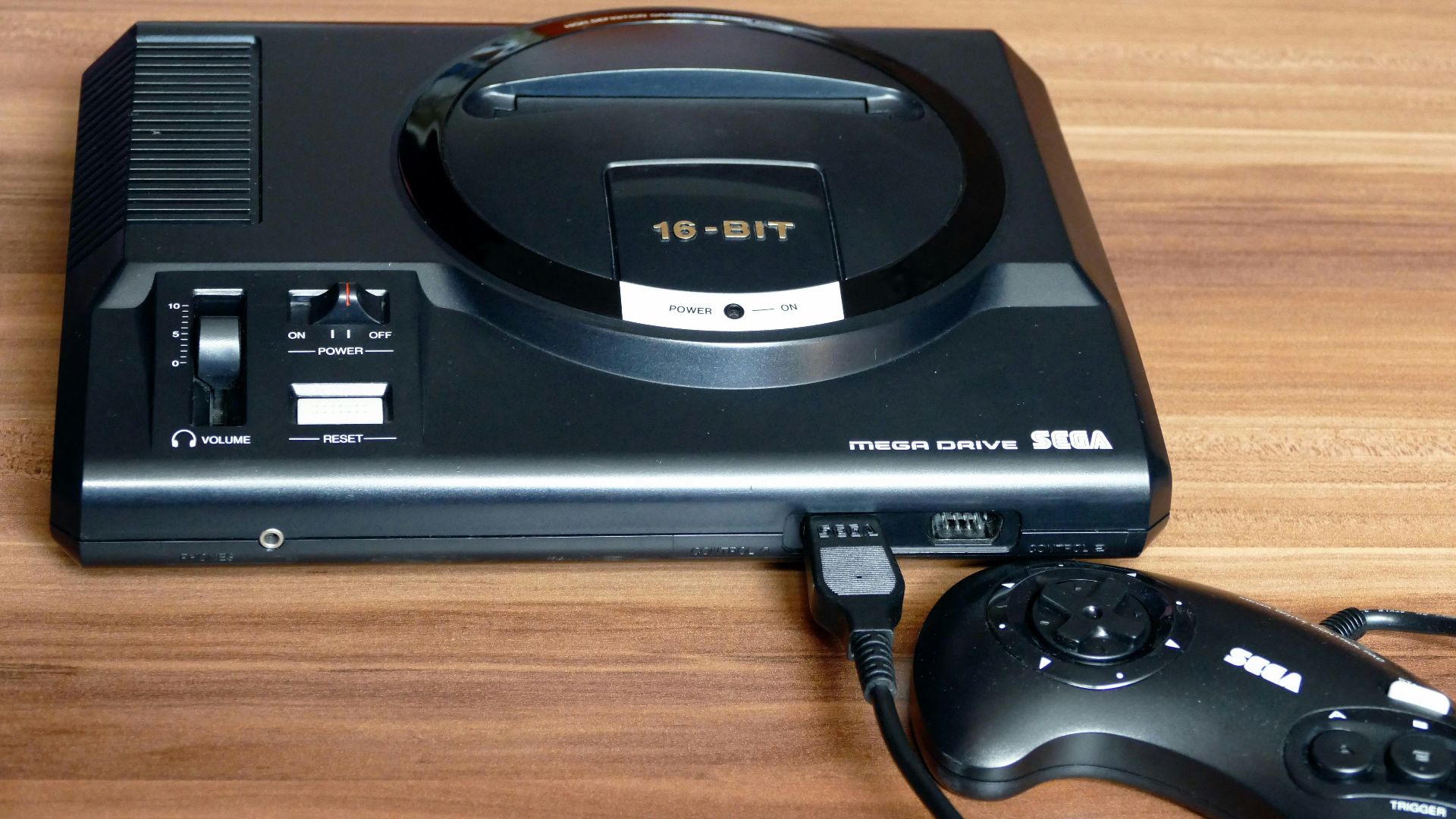 a video game system sitting on top of a wooden table