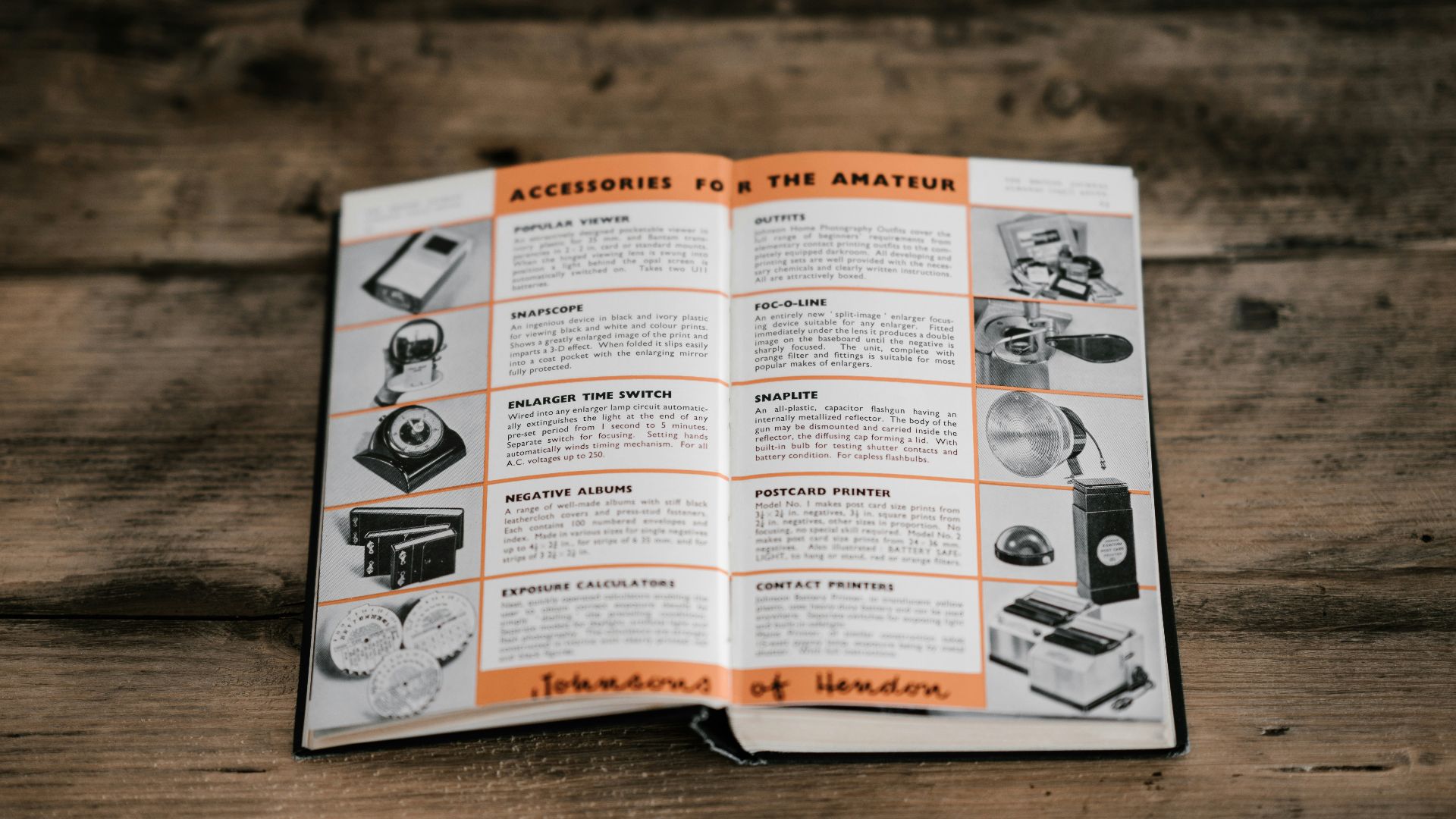 opened book laid in brown table