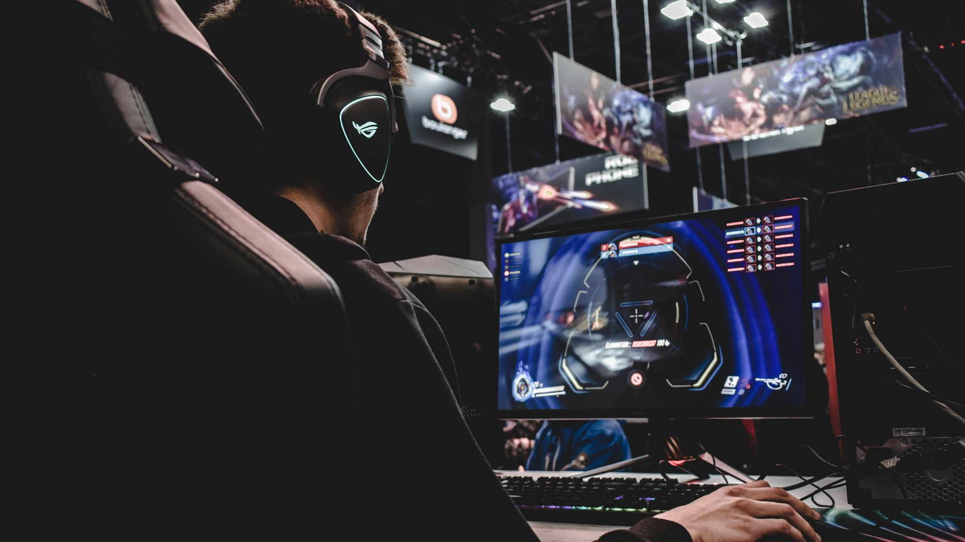 person sitting on gaming chair while playing video game