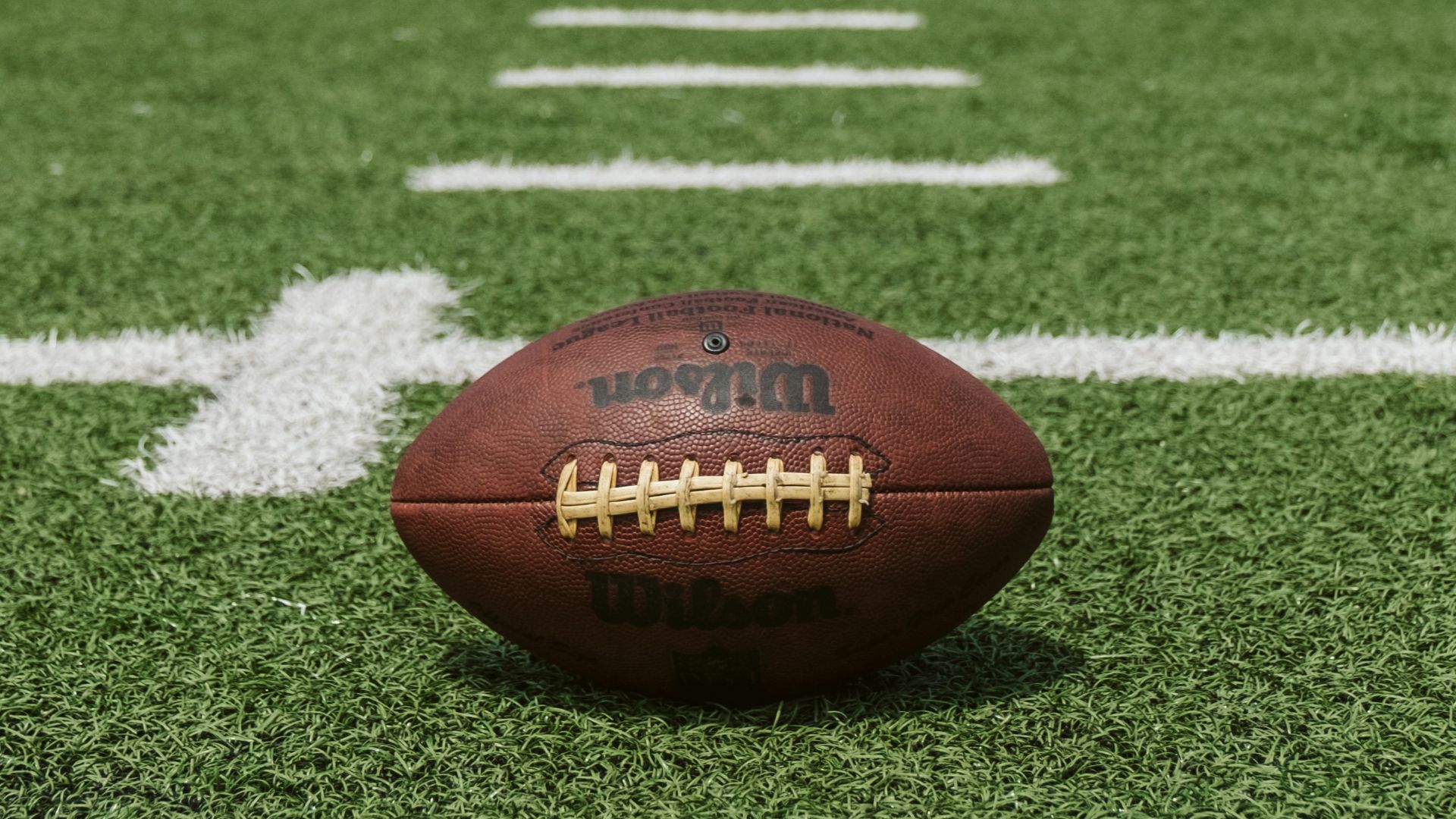 brown and black Wilson football