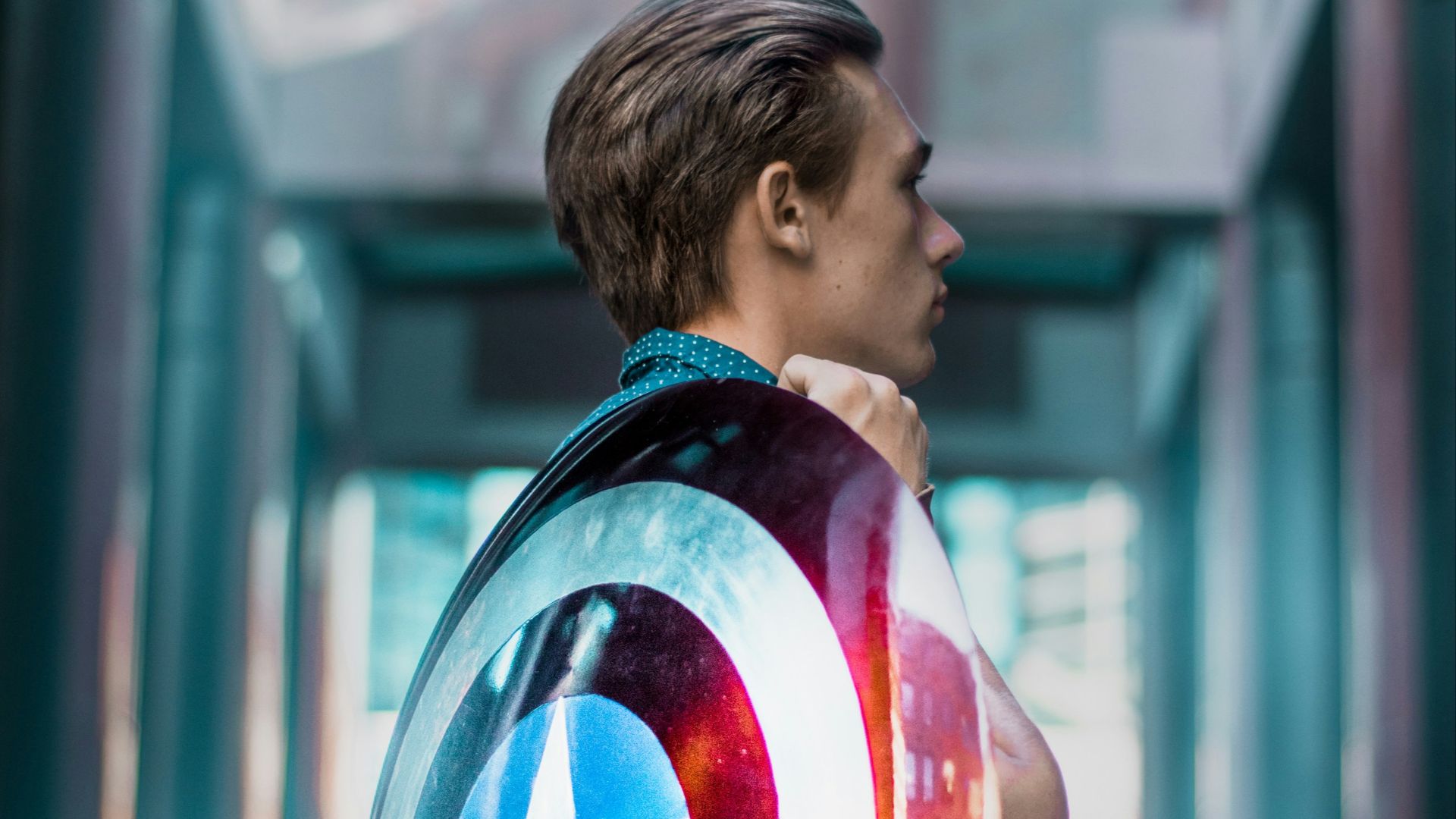 man carrying Captain America's shield