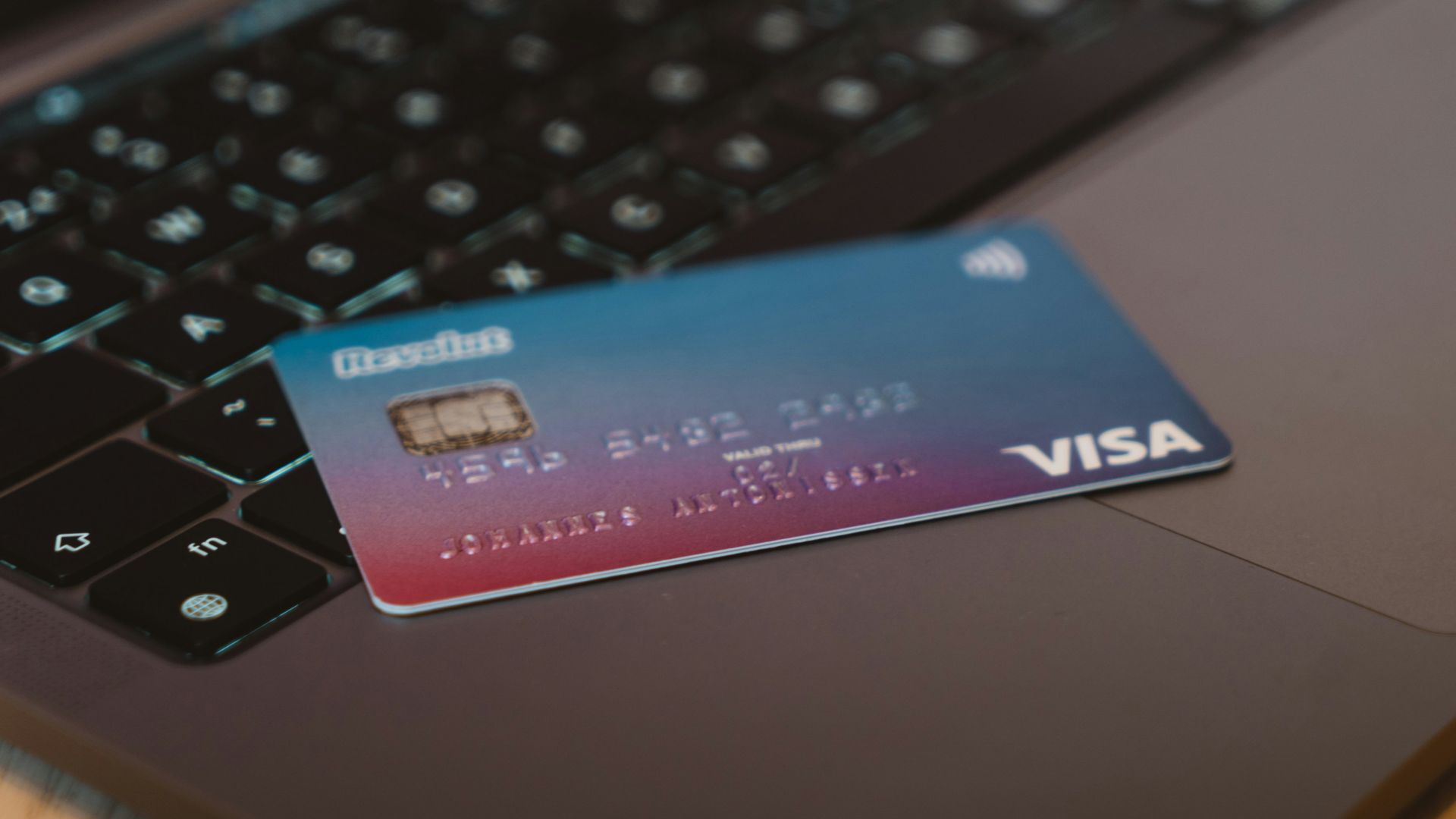 blue and white visa card on silver laptop computer