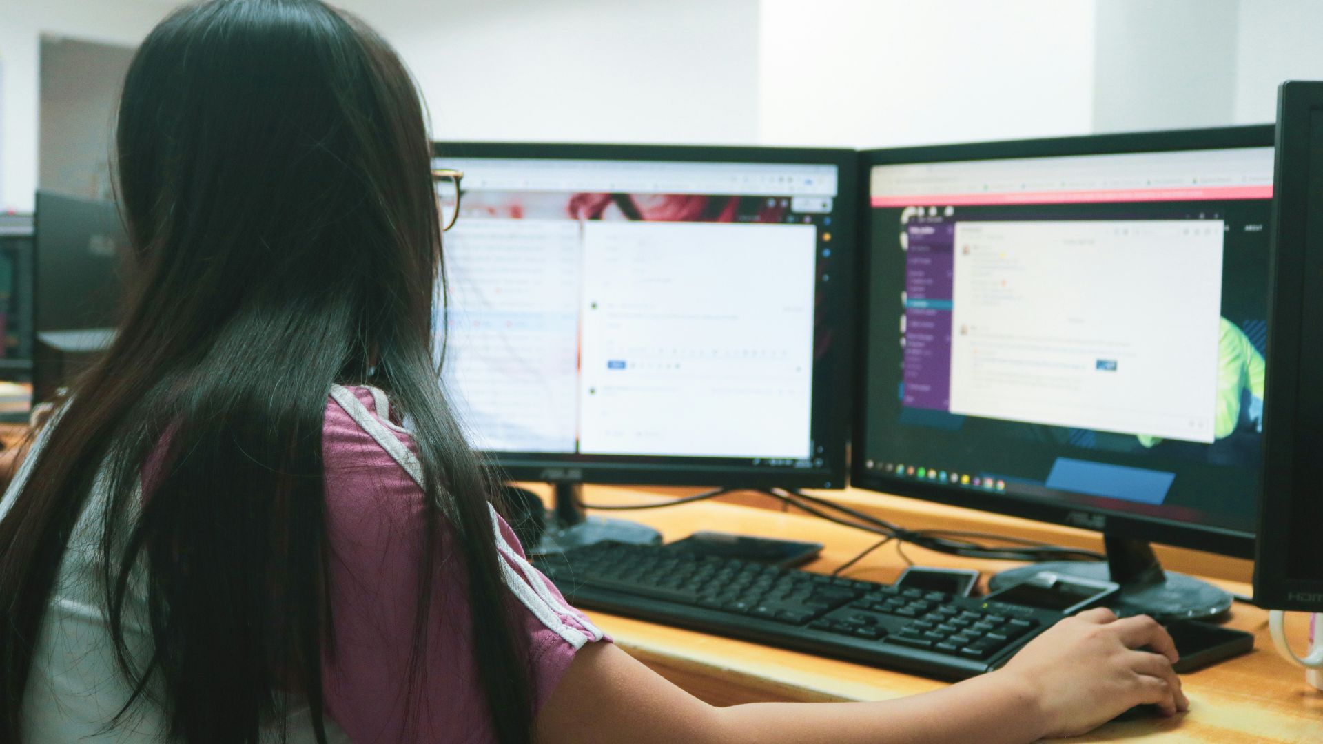 woman using desktop computer