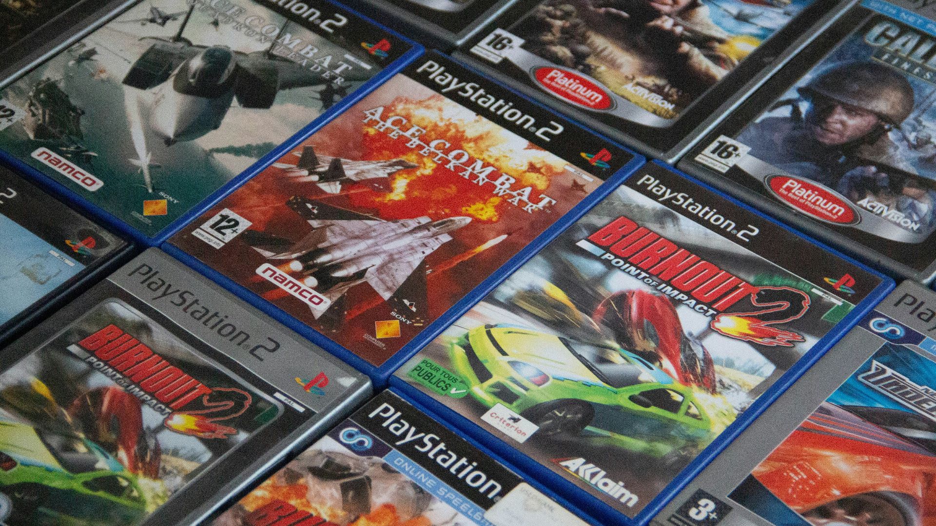 a pile of video games sitting on top of a table