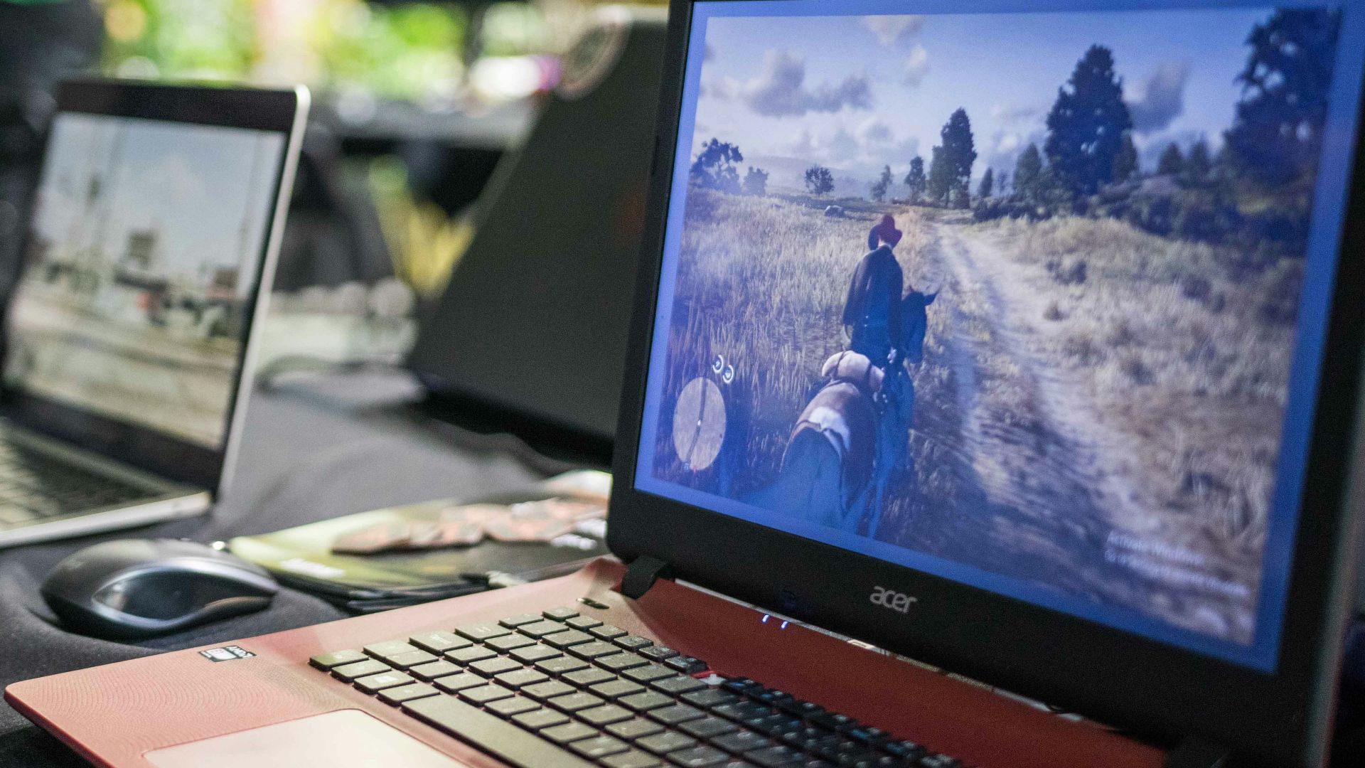 a couple of laptops sit on a table