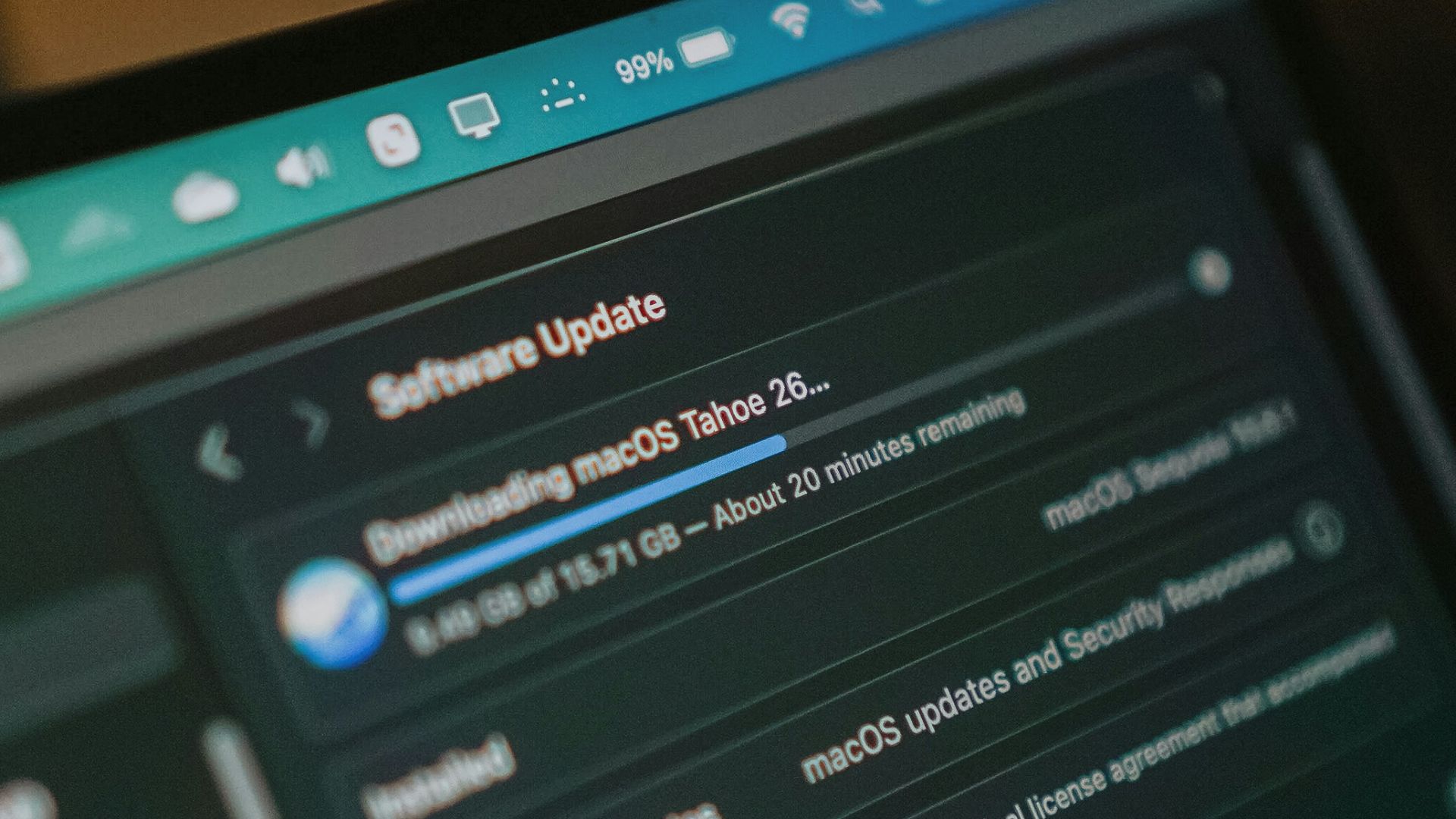 Macbook screen shows macos software update downloading