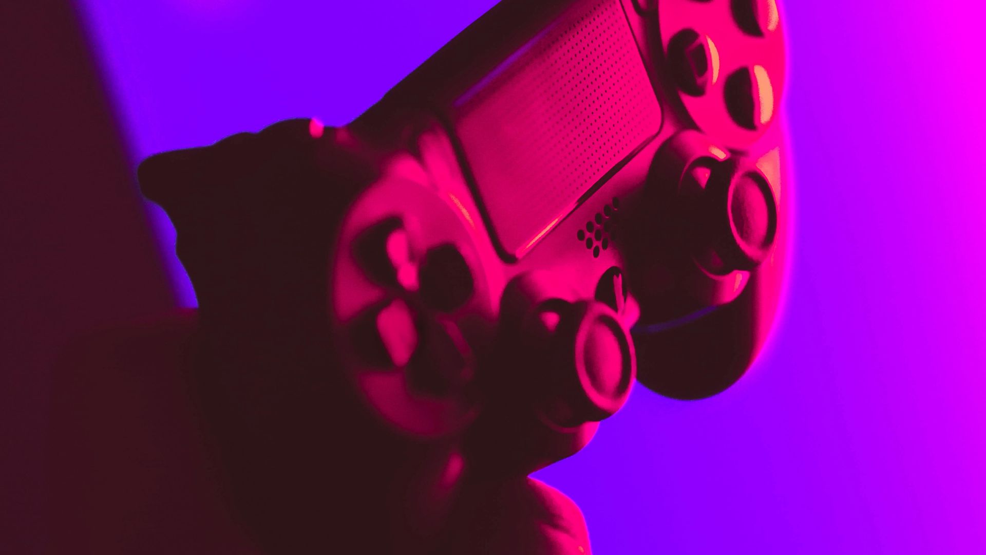 person holding black and gray game controller