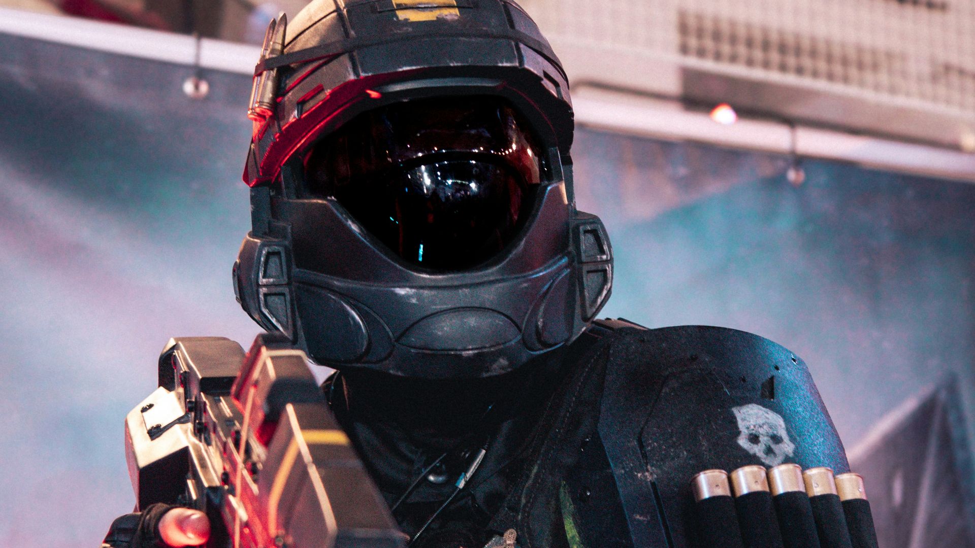 A man in a helmet holding a gun