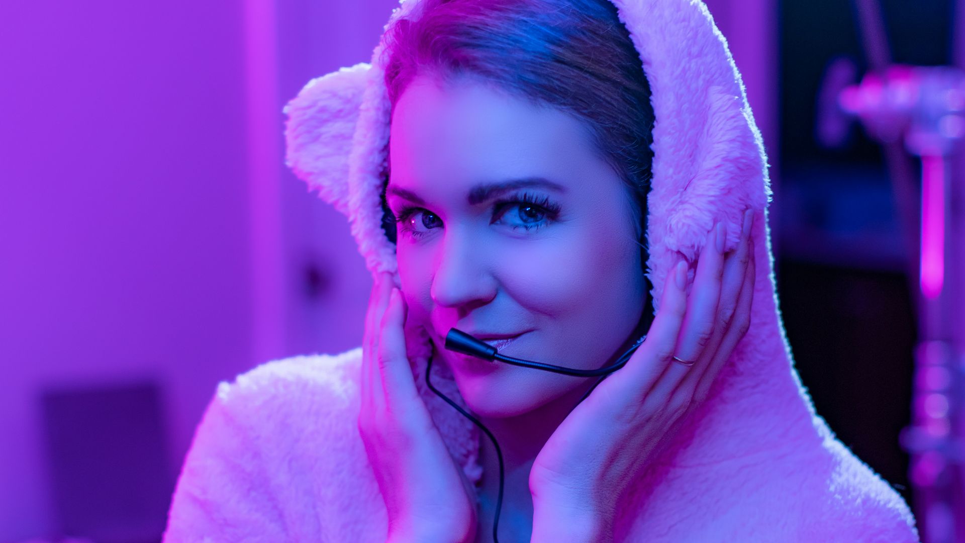 woman in white bathrobe covering her face with white towel