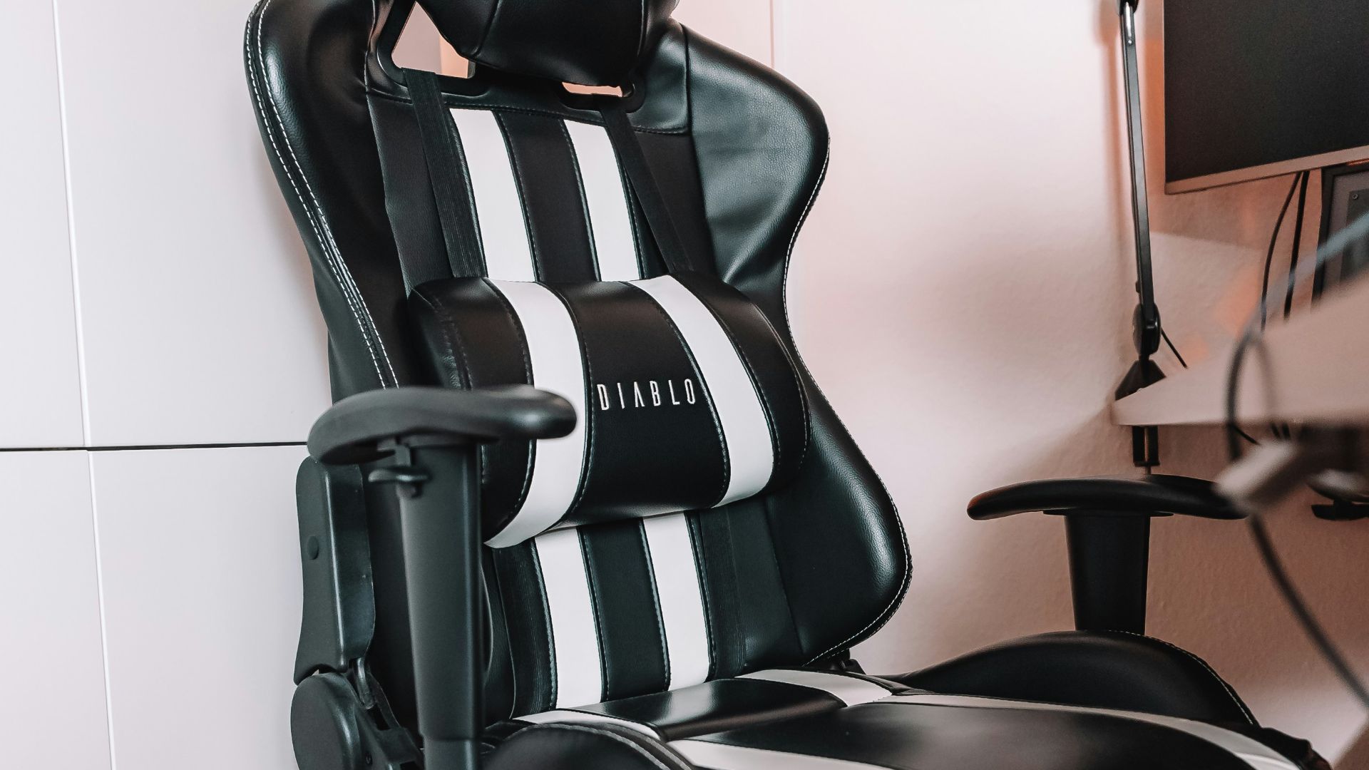 a black and white office chair sitting in a room