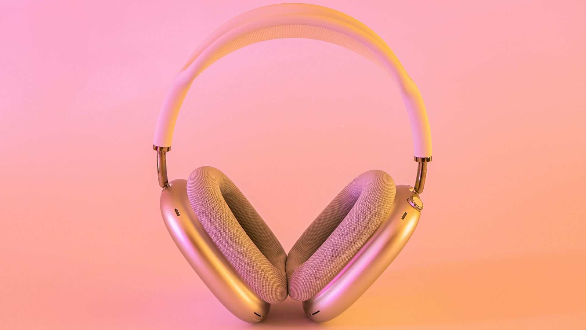 pink and white wireless headphones