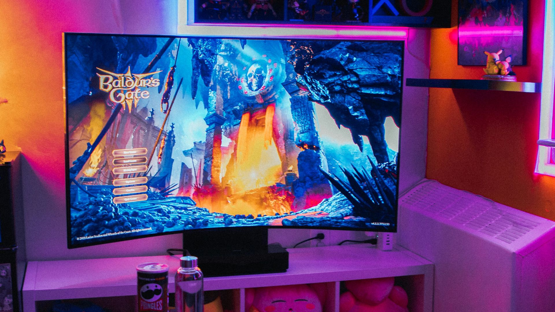 a living room with a television and a game system