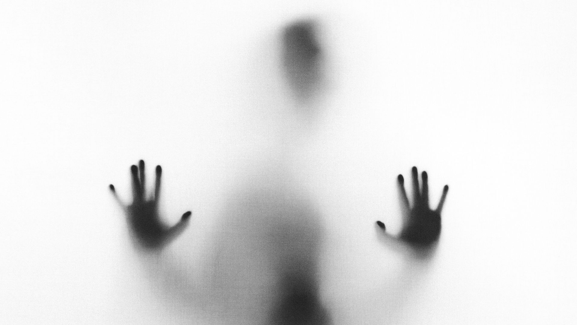 person behind fog glass