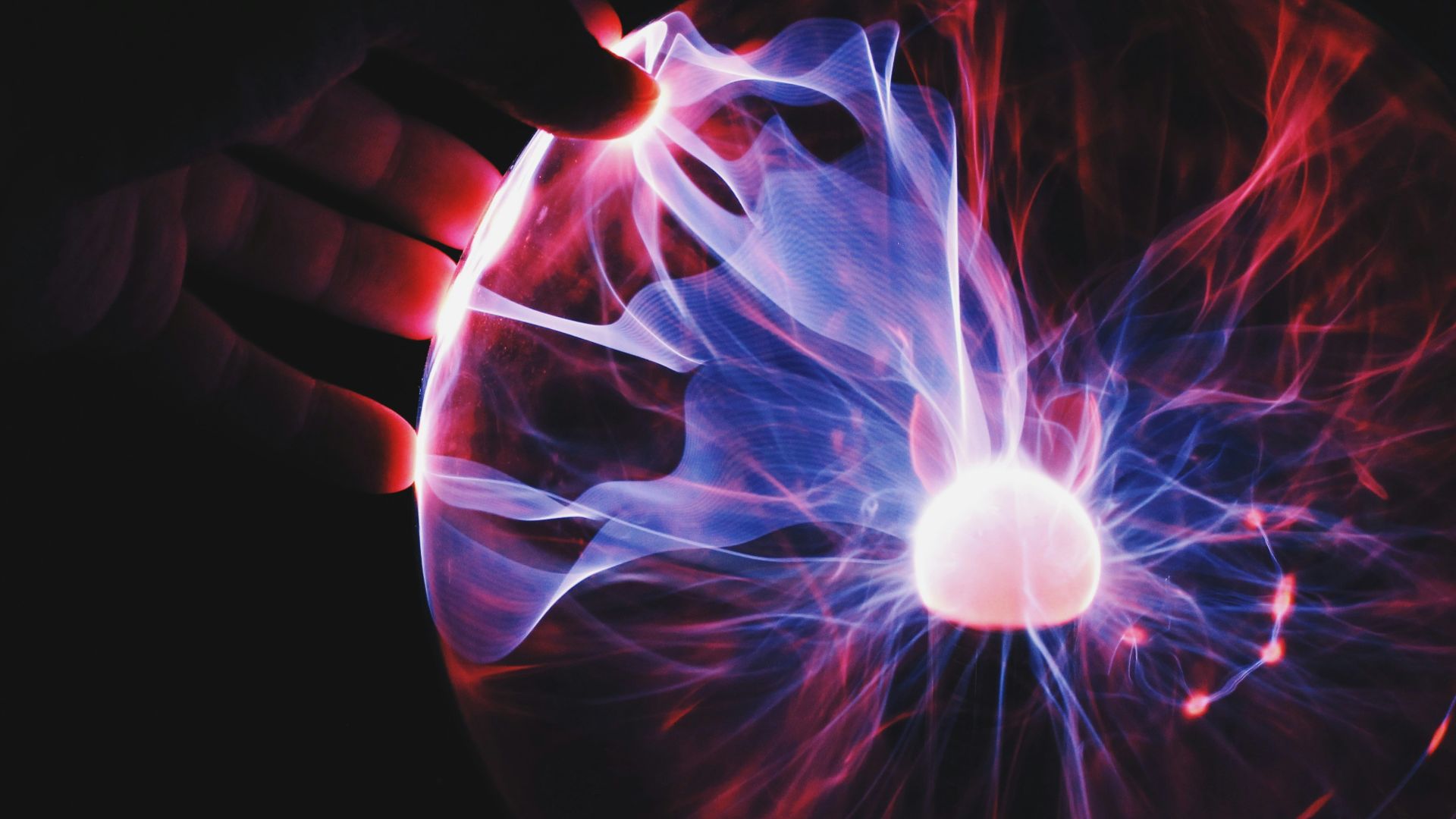 human hand holding plasma ball