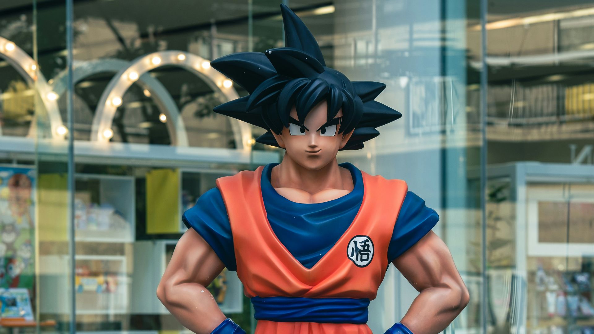 a statue of a man in a blue and orange outfit