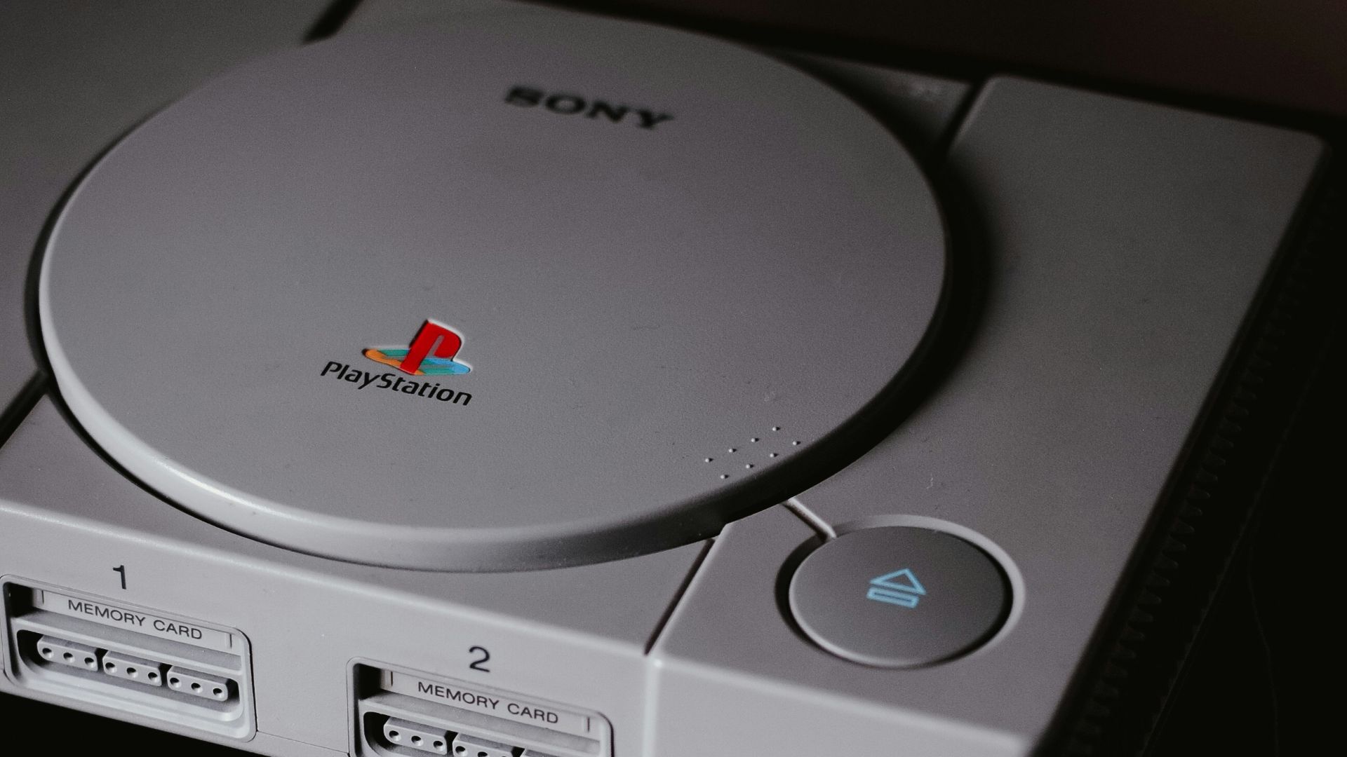 photo of closed Sony PS1 with DualShock 1