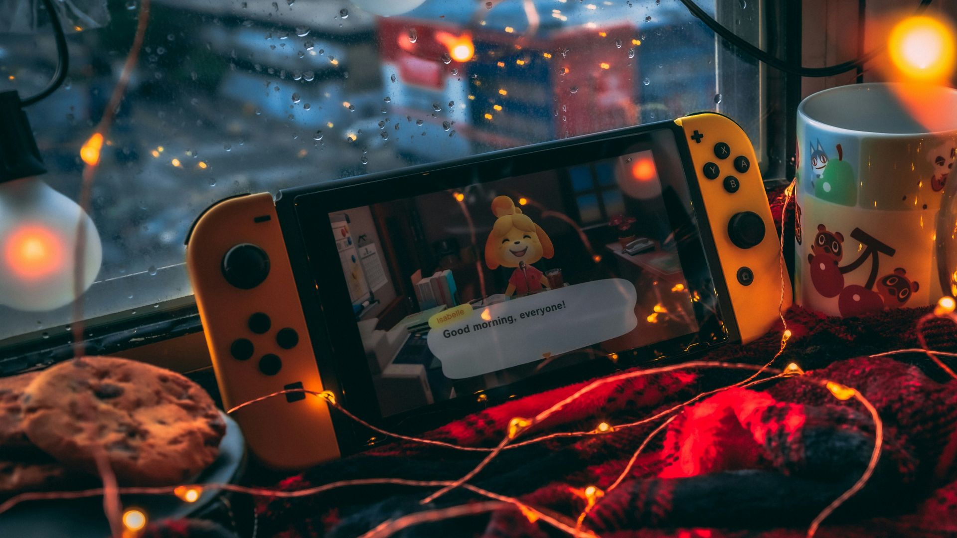 a video game console and a mug