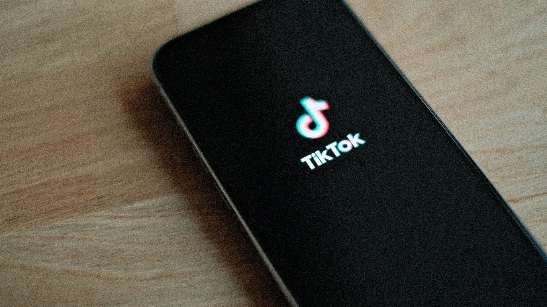 A close up of a cell phone on a table