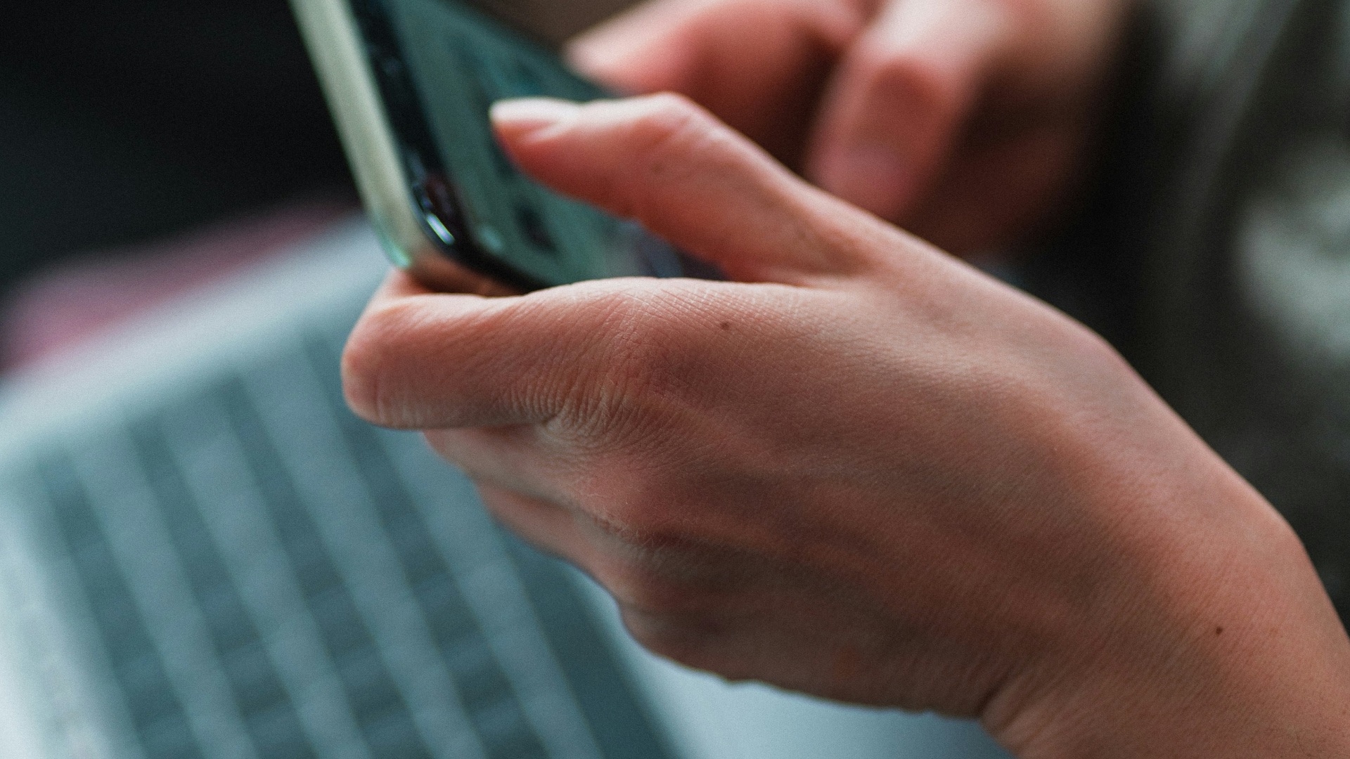 person holding black iphone 7