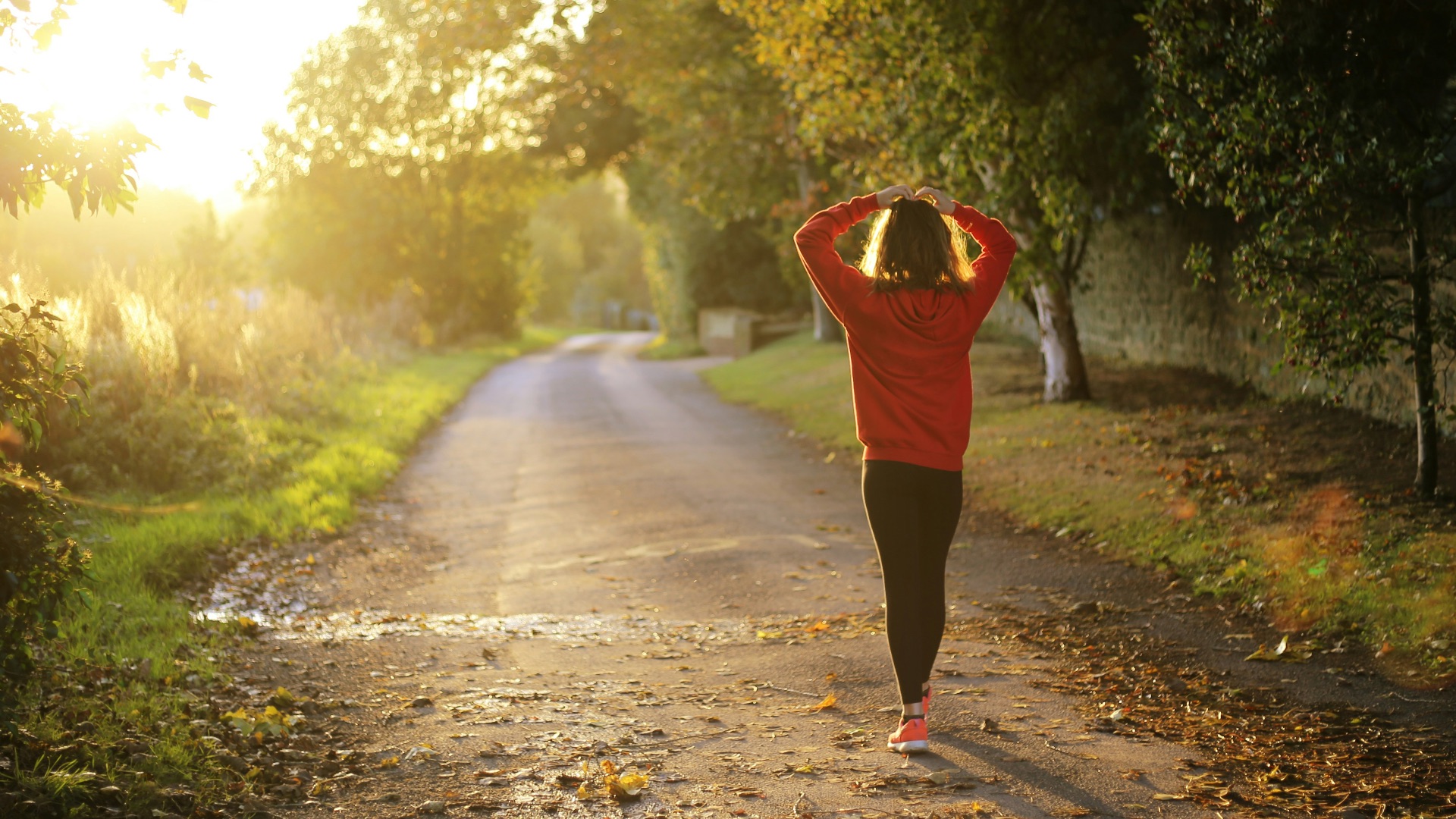 woman walking on pathway during daytime