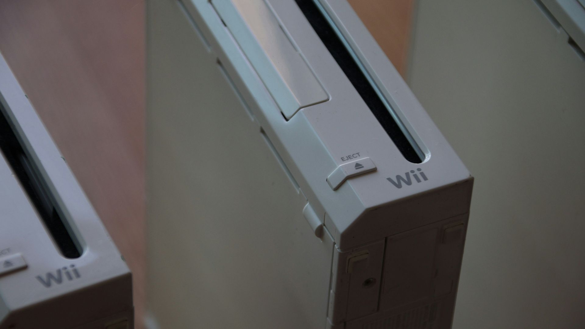 two nintendo wii game consoles side by side