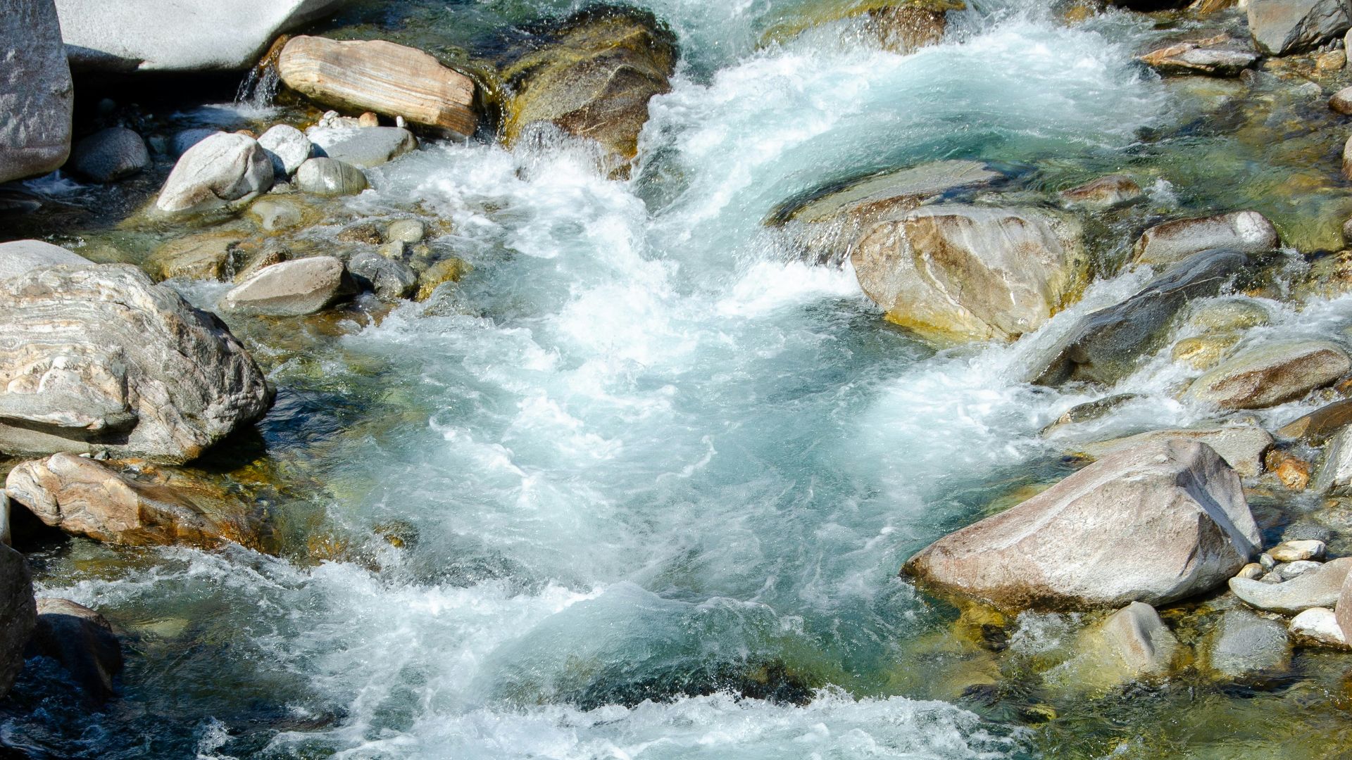 gray rocks on river during daytime