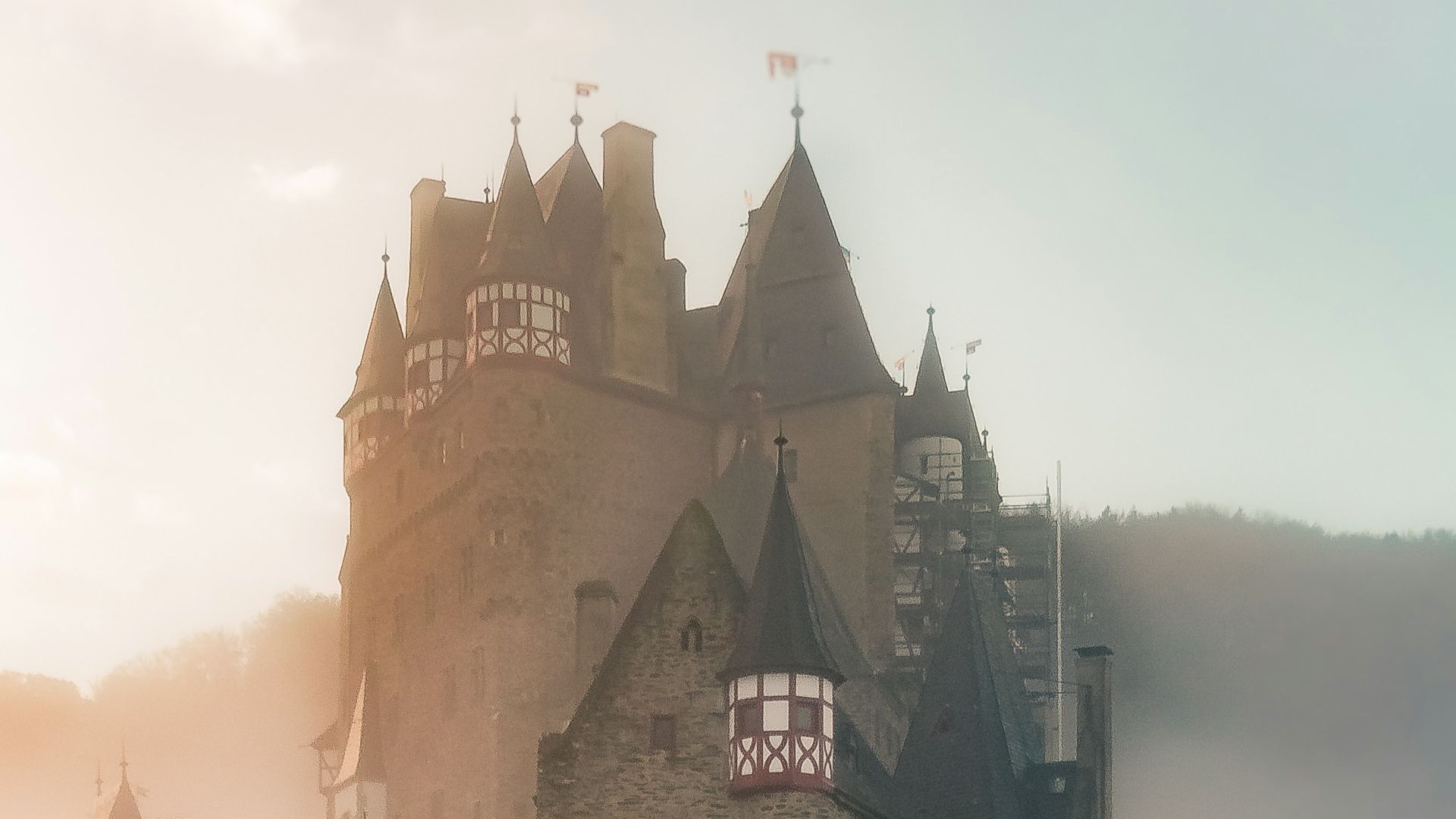reflection of a castle surrounded with fogs