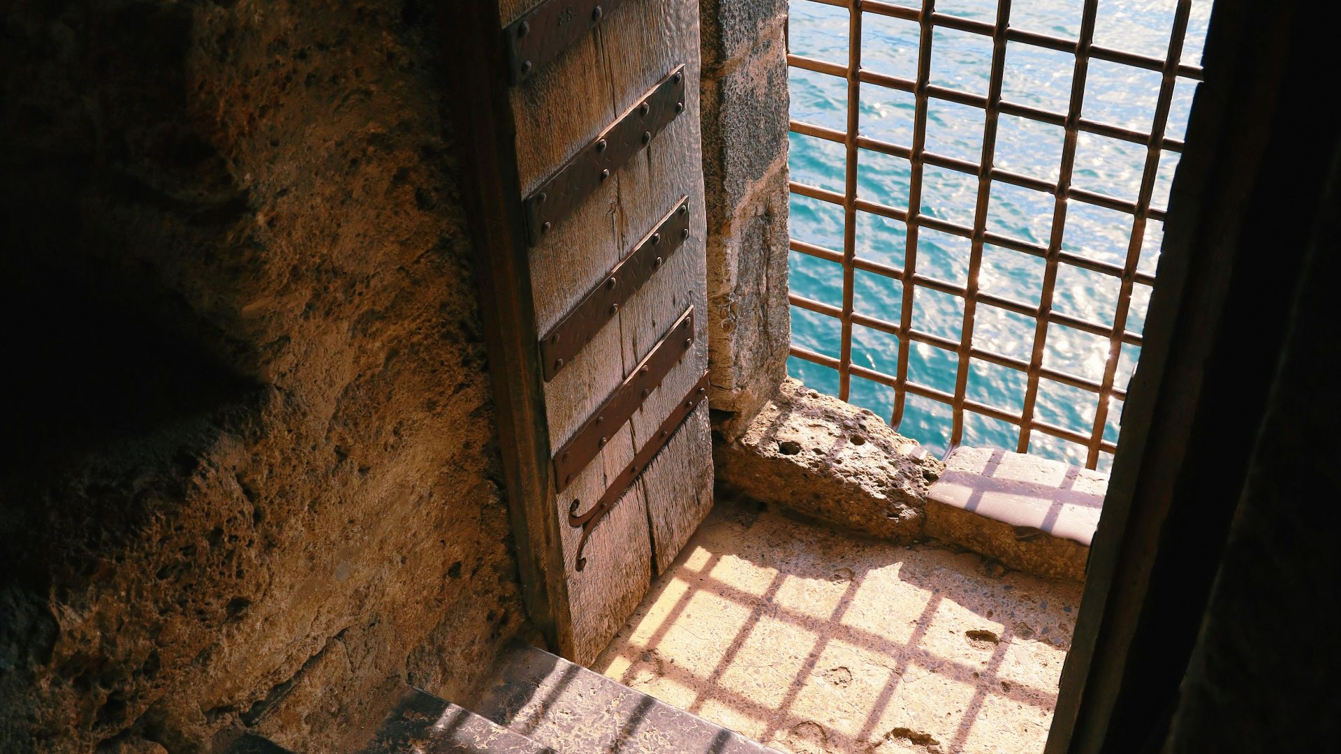 a window with bars on the outside of it