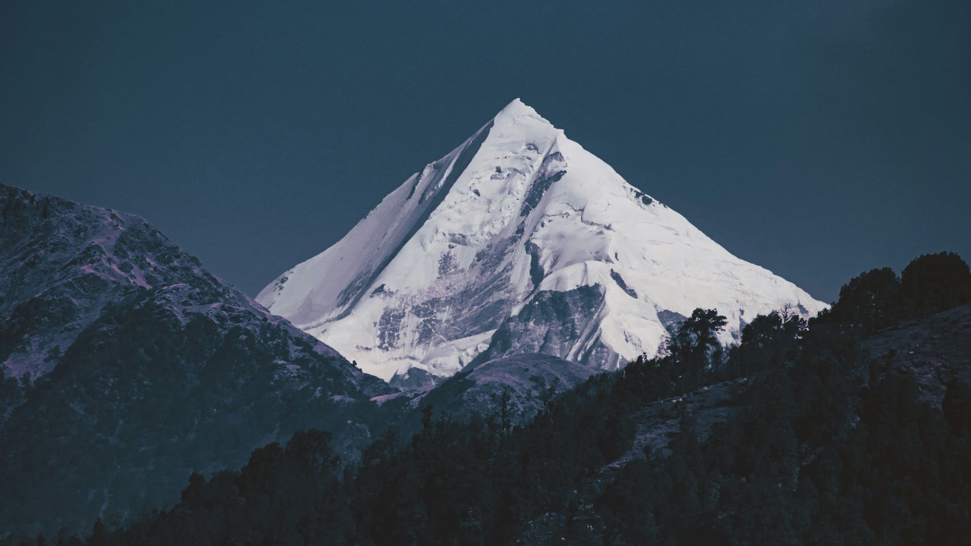 snow covered mountain under blue sky during daytime
