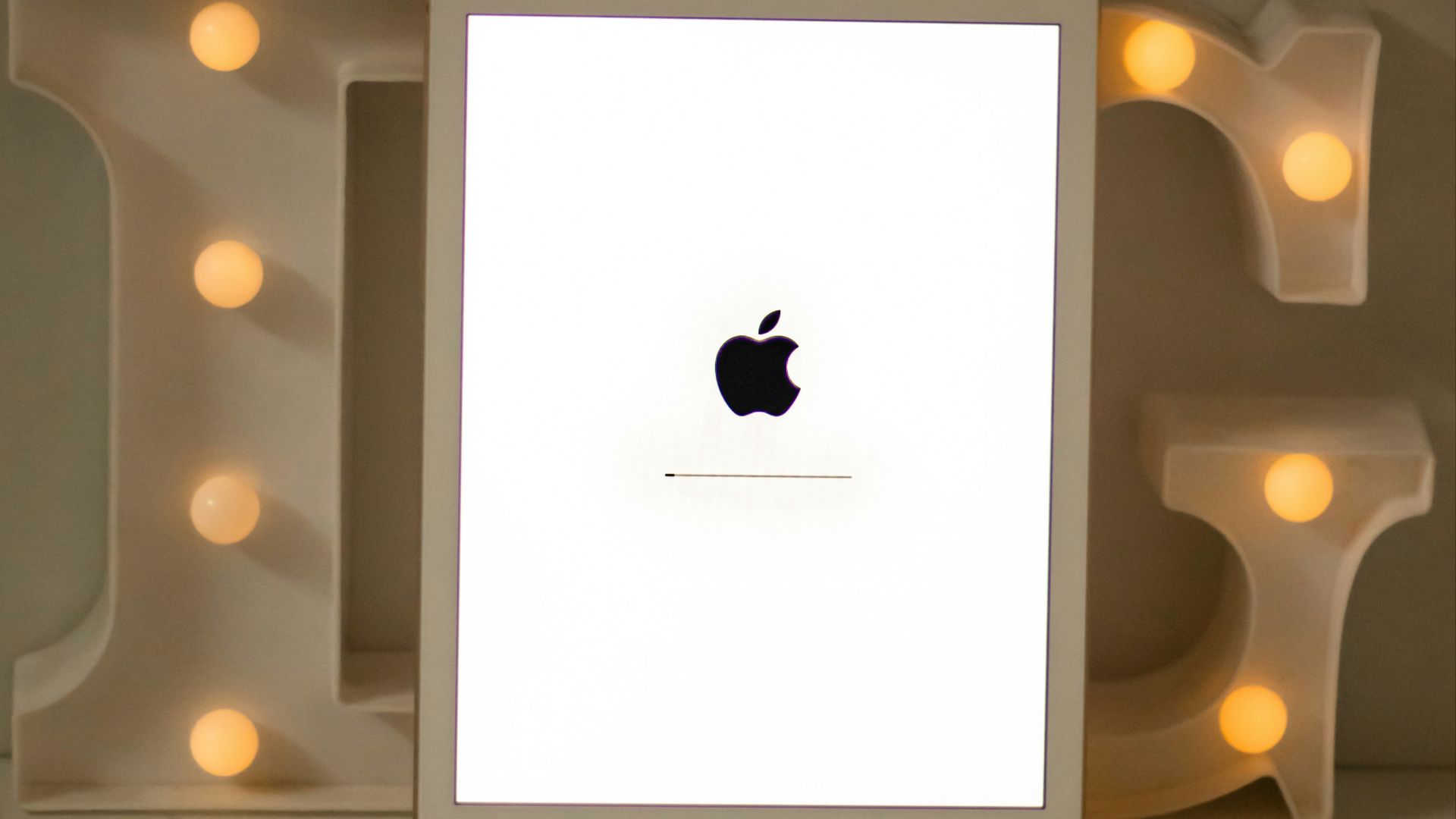 white ipad on white table