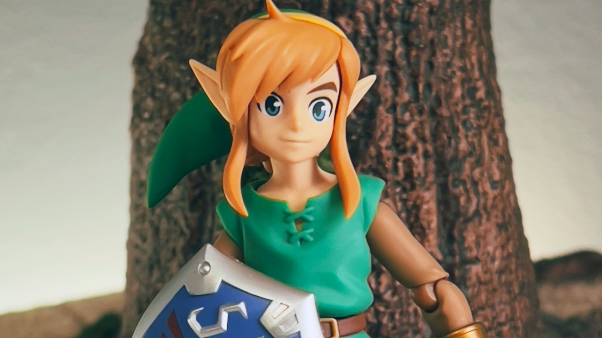 a toy girl holding a sign