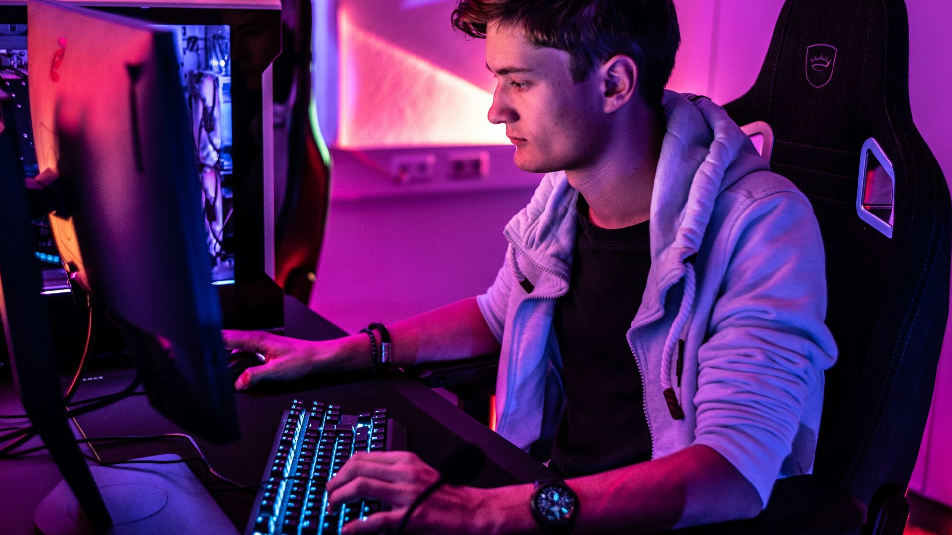 a man sitting in front of a computer keyboard