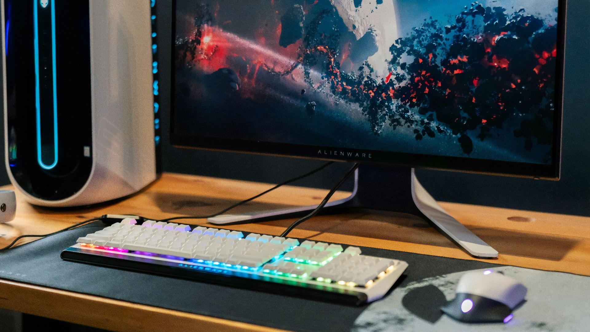 black flat screen computer monitor beside white computer keyboard