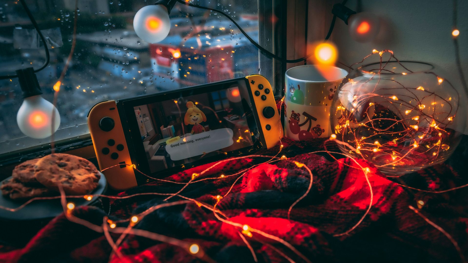 a video game console and a mug