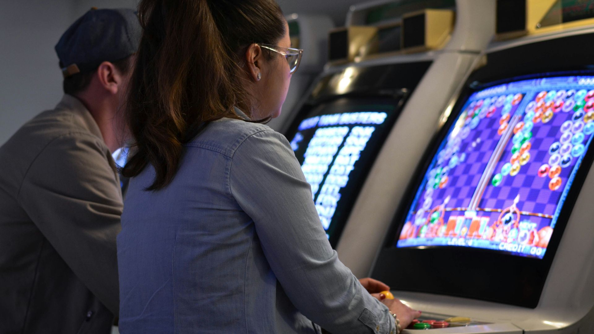 woman in gray long sleeve shirt wearing eyeglasses