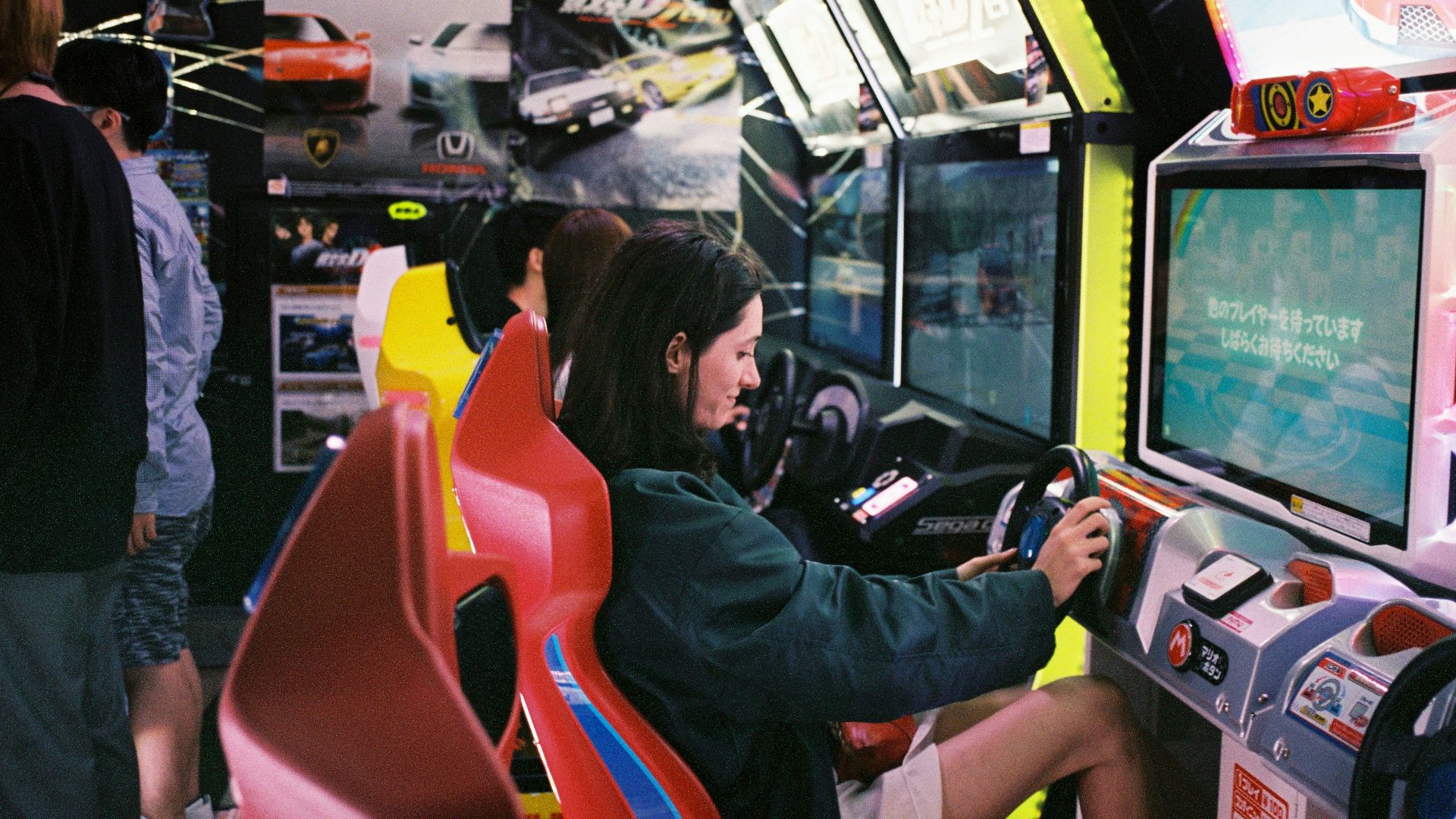 woman driving arcade machine