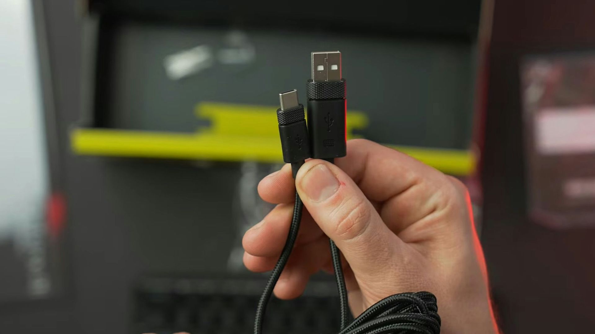 a person holding a usb device in their hand