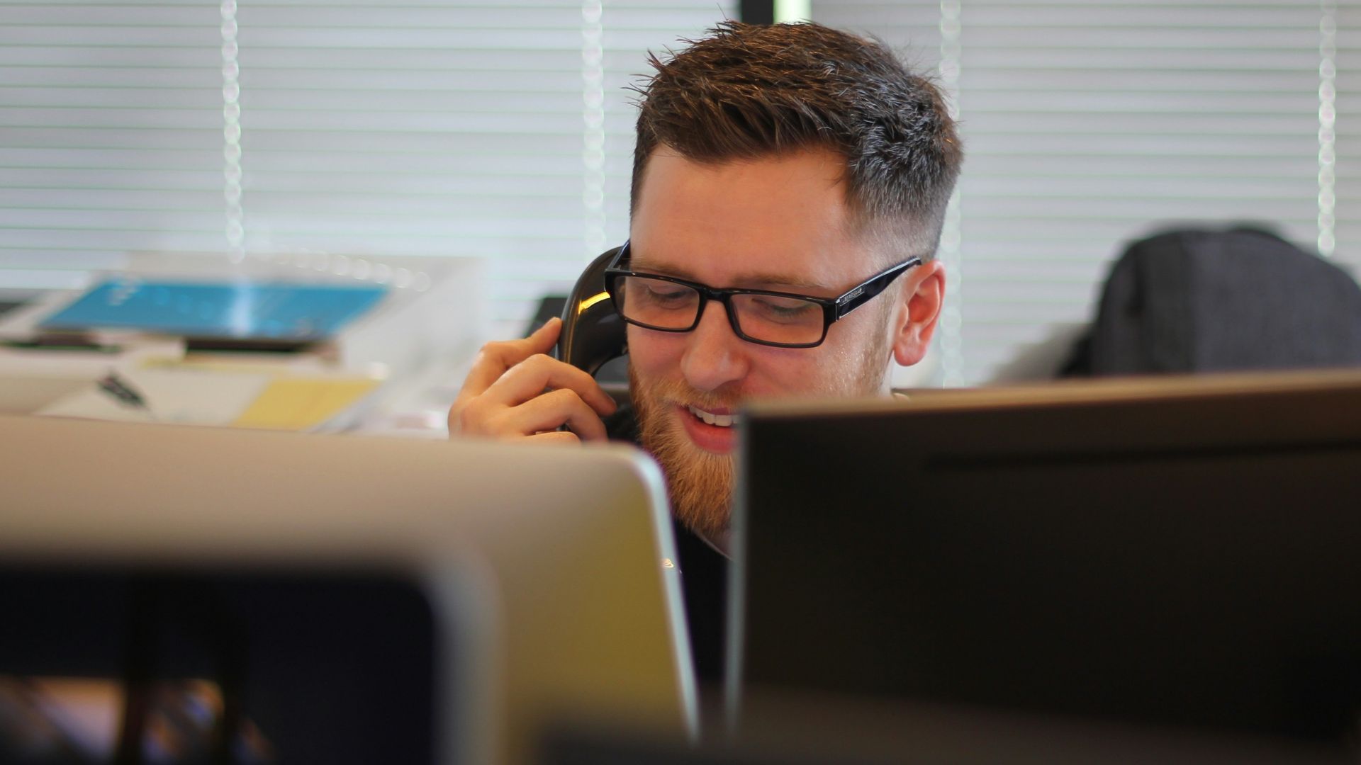 man using IP phone inside room