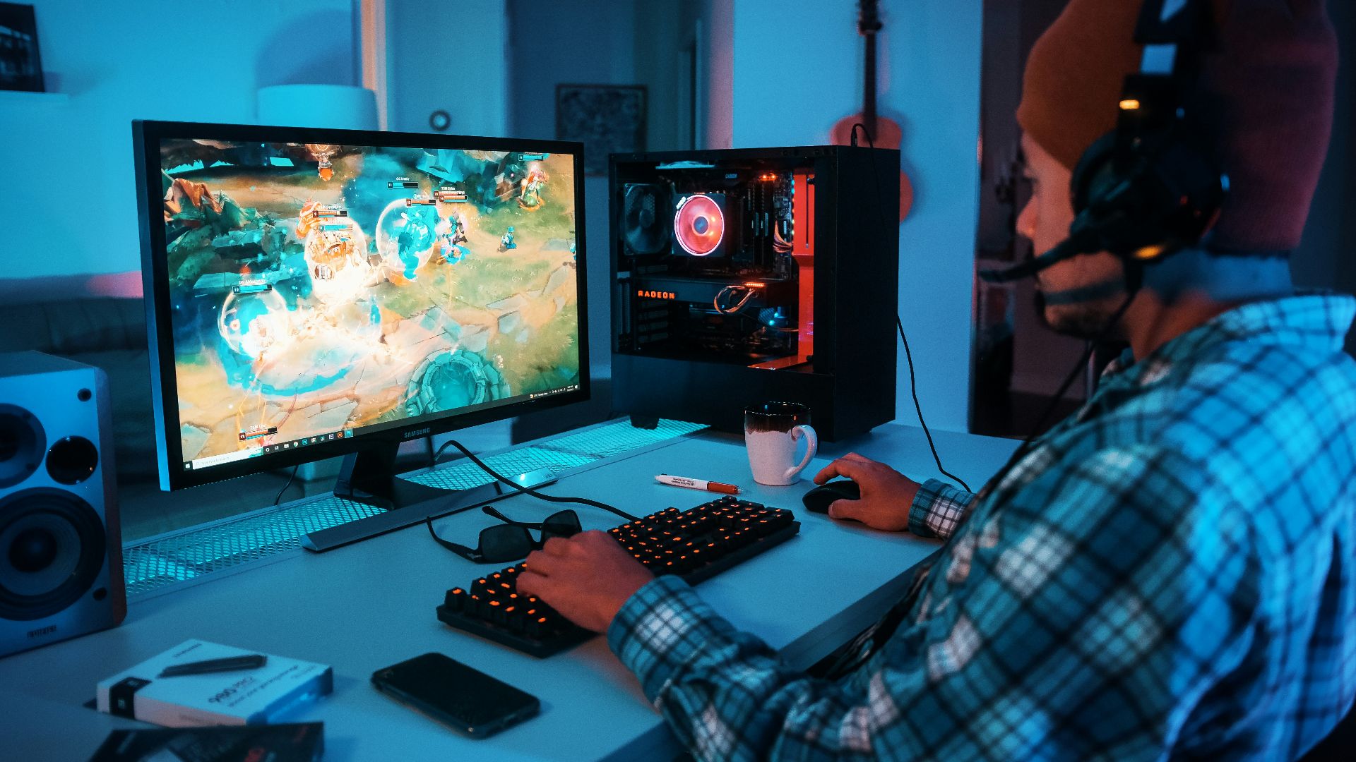 a person wearing headphones and using a computer