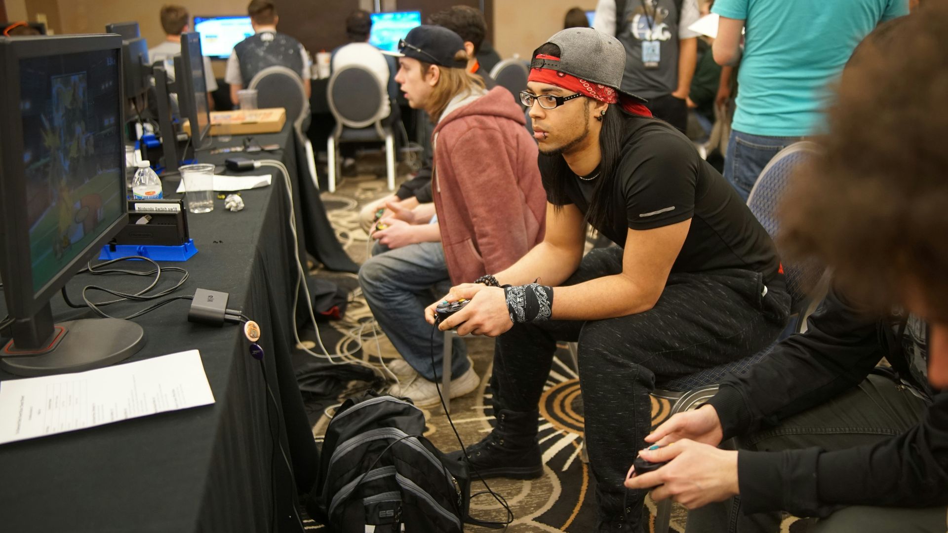 man sitting on chair playing games