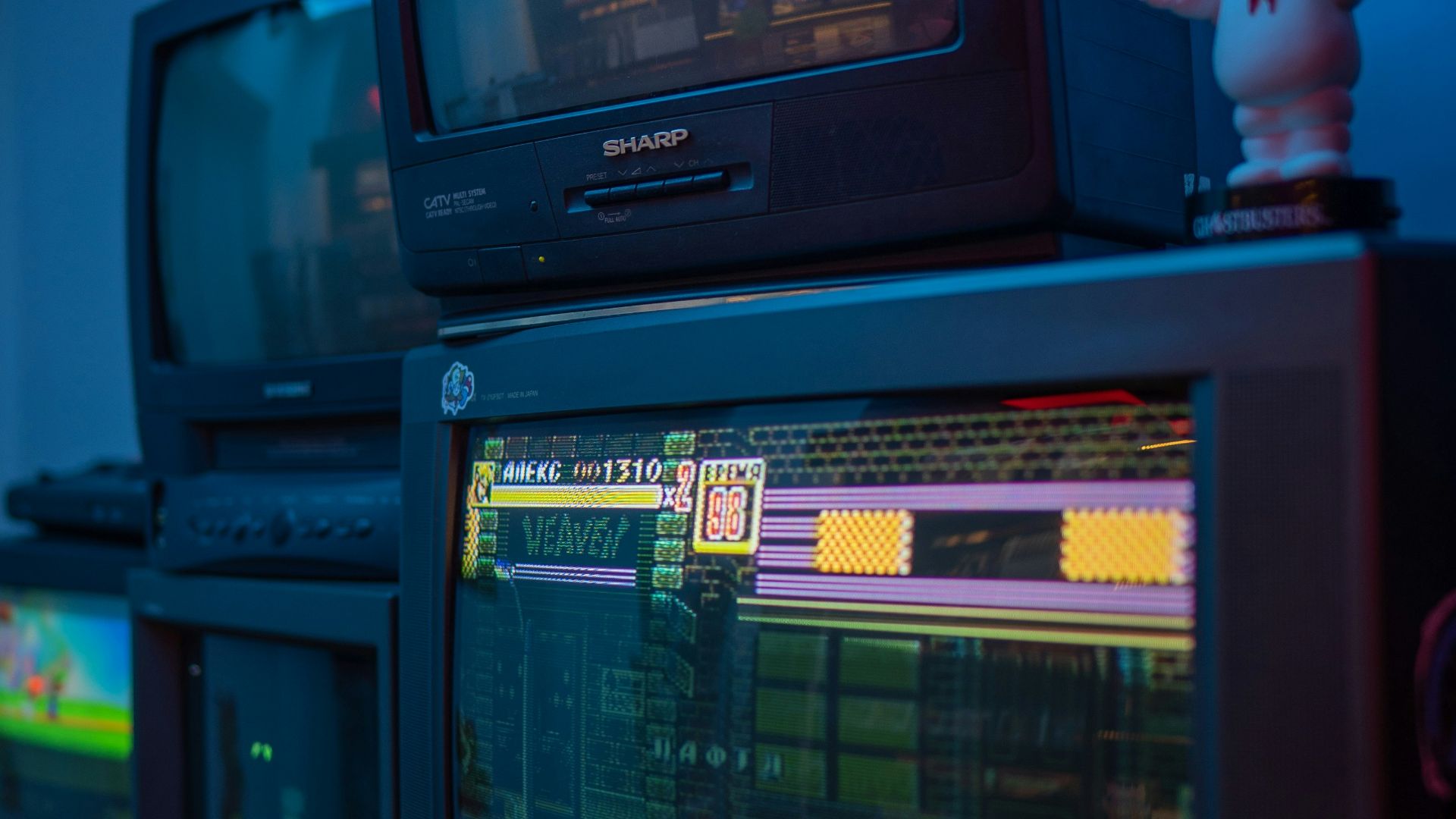 black crt tv turned on on brown wooden tv rack