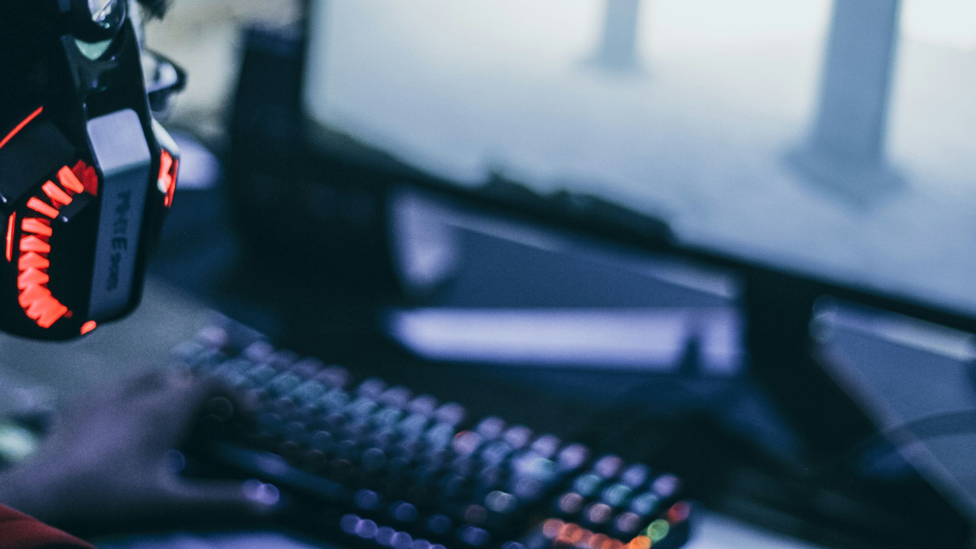 person wearing orange and black headphones