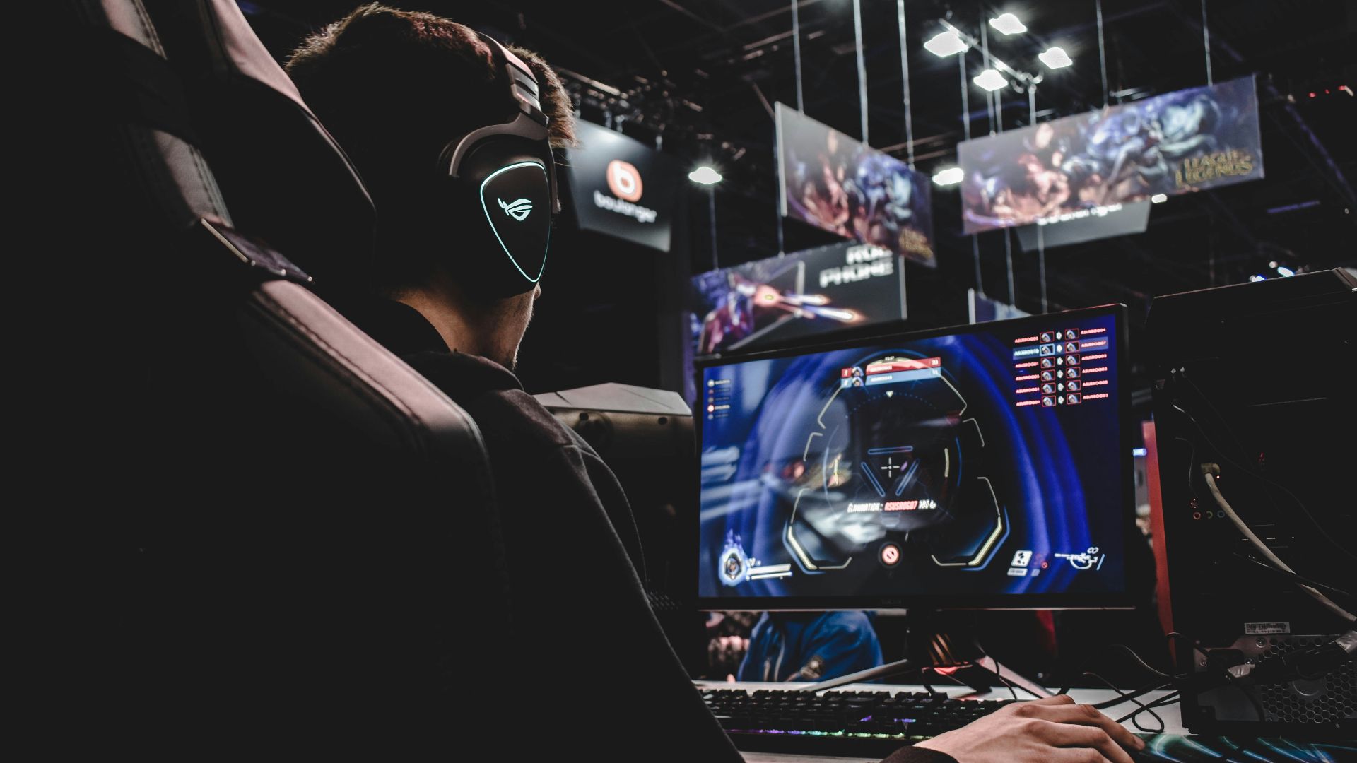 person sitting on gaming chair while playing video game