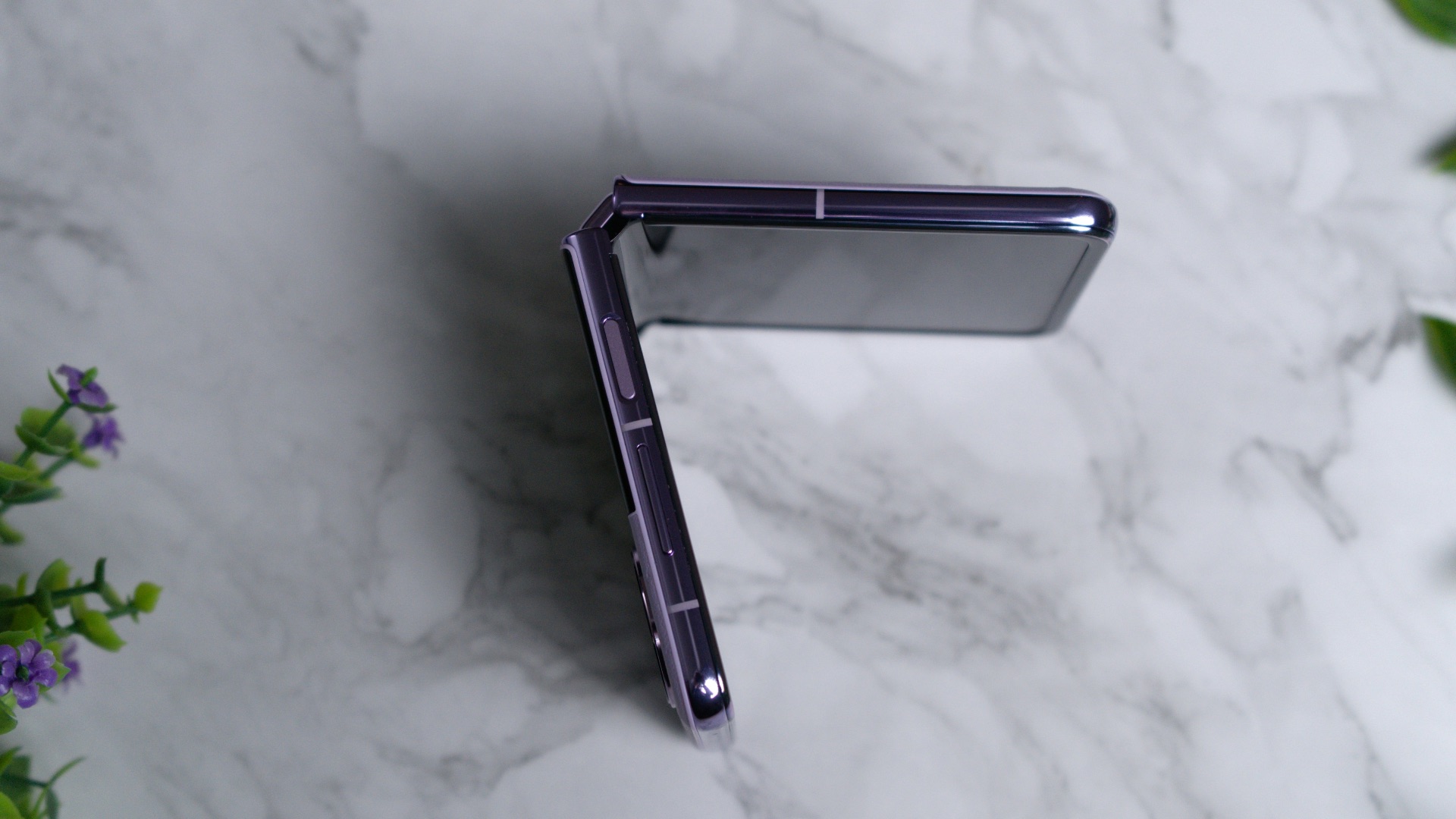 a close up of a cell phone on a marble surface