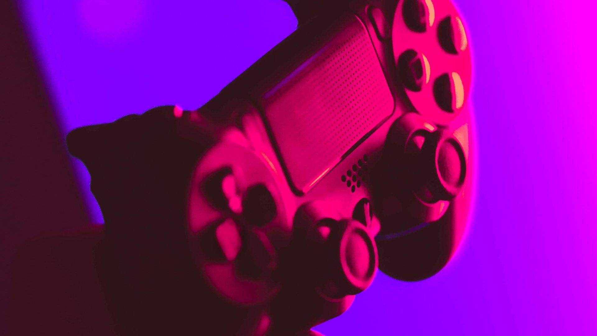 person holding black and gray game controller