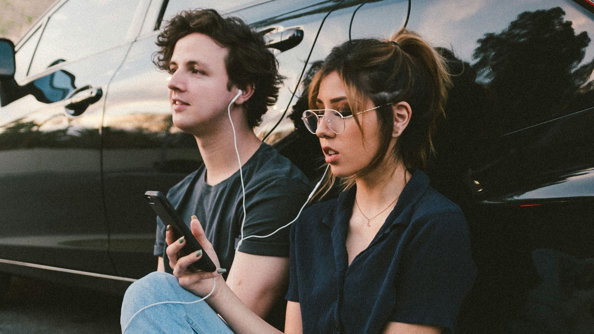man and woman beside vehicle