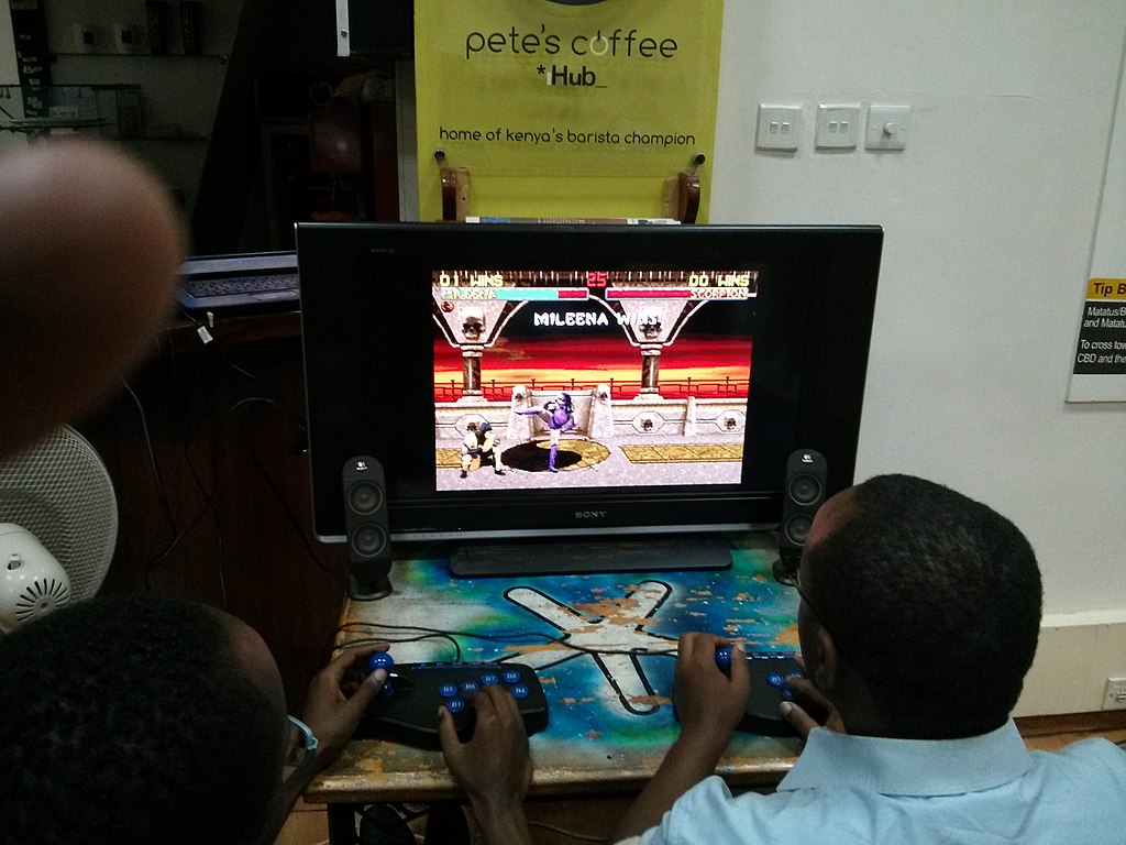 1024px-Gamers_playing_Mortal_Kombat_at_a_Nexgen_gaming_event_in_Nairobi.jpg