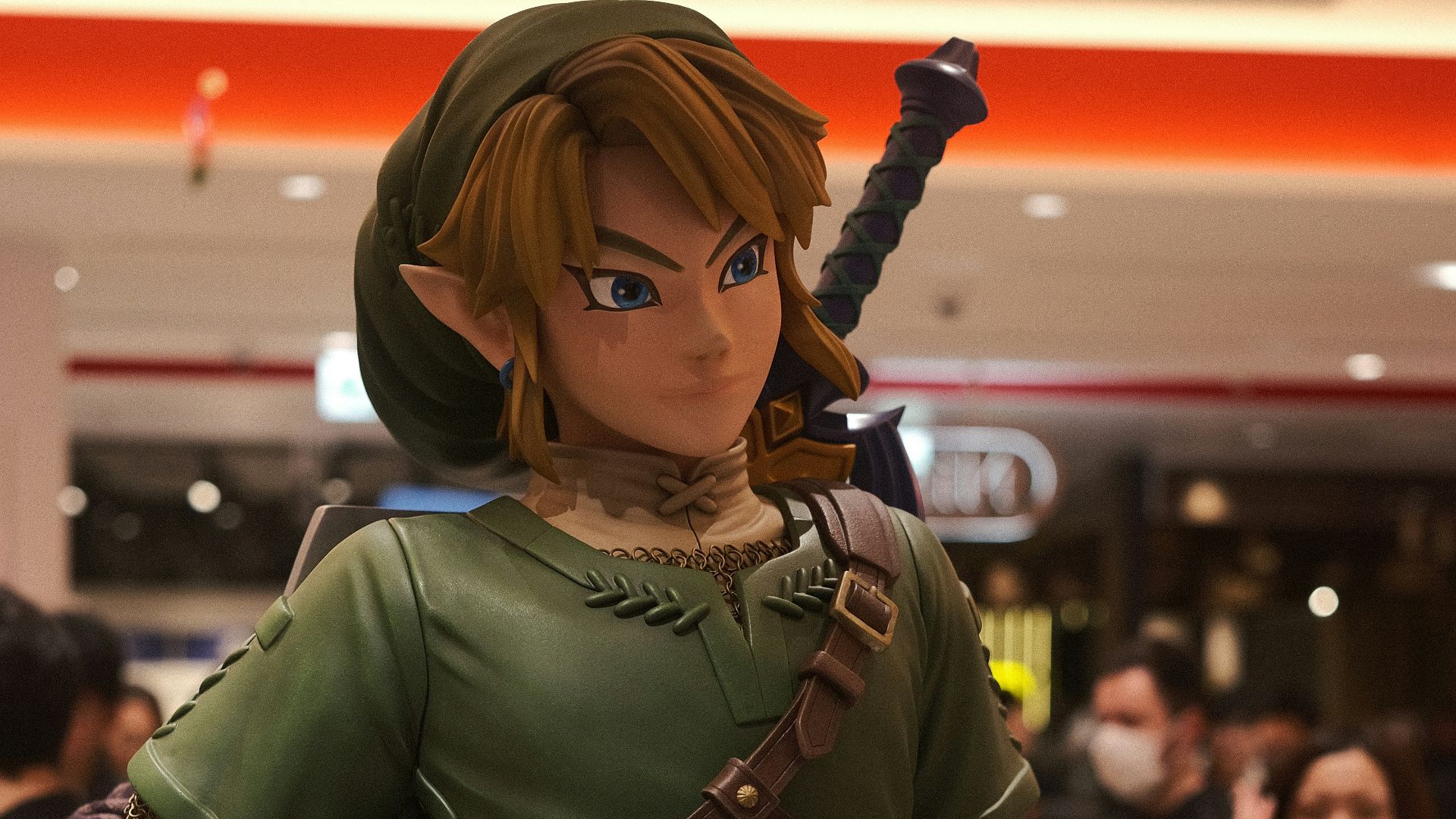 a statue of a woman in a green outfit