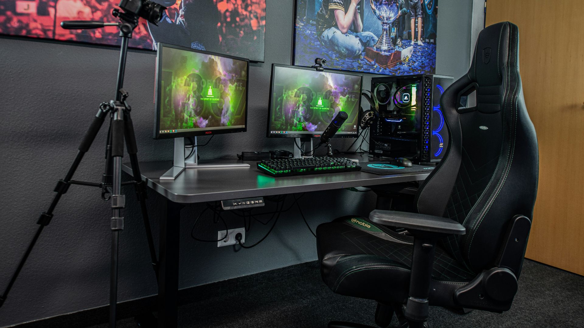 black flat screen computer monitor on black wooden desk