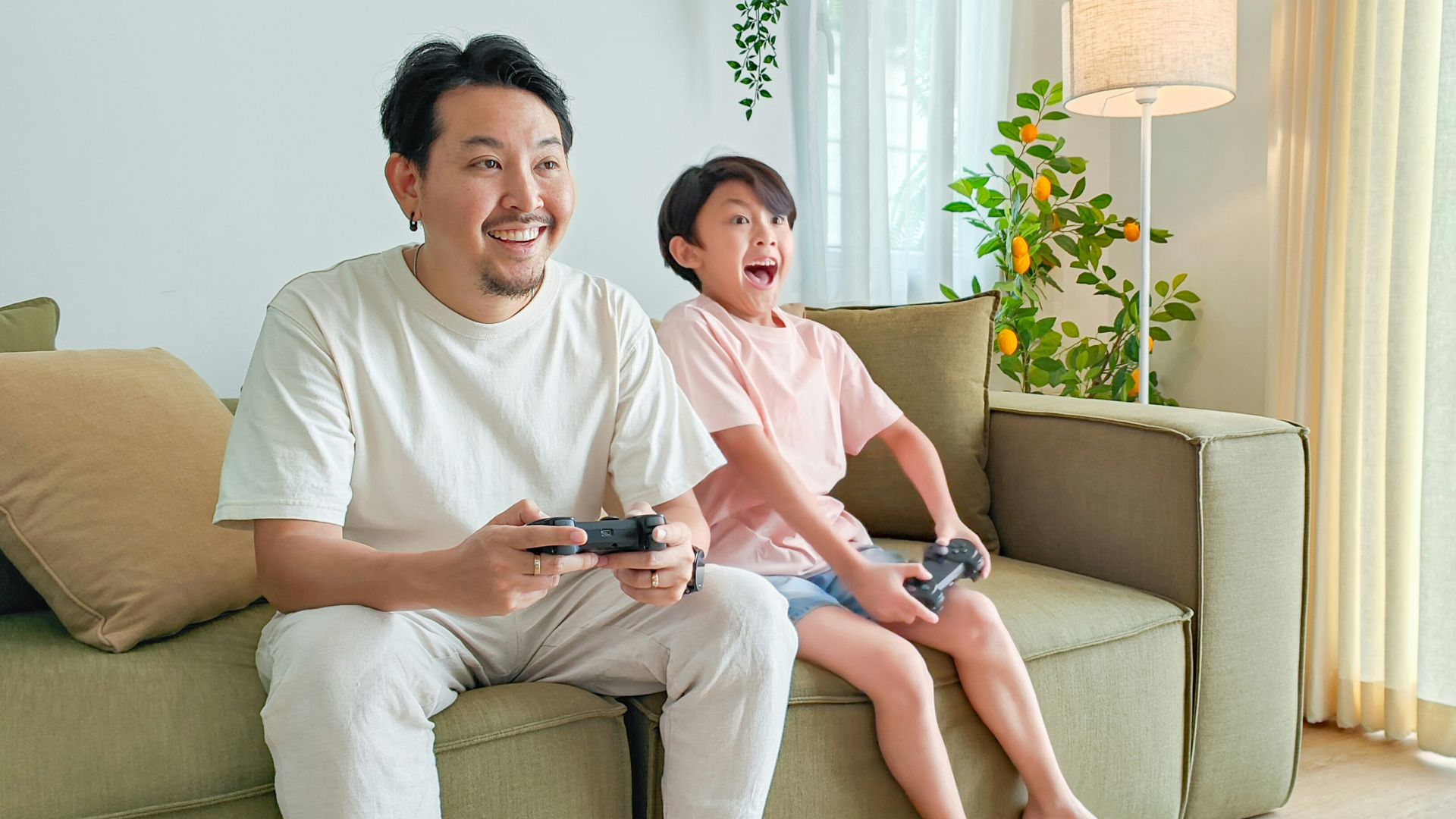 a person and a child sitting on a couch